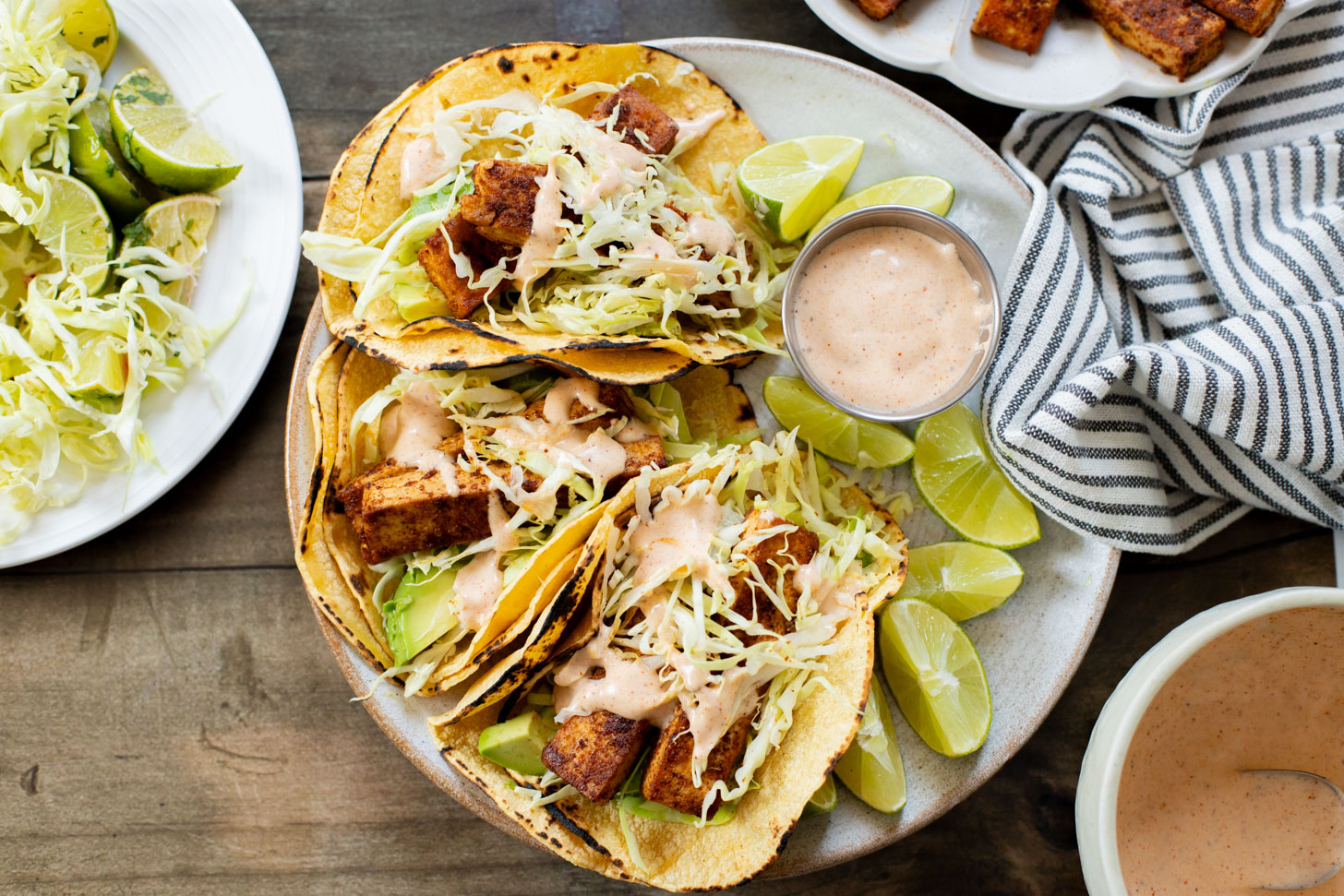 These Blackened Tofu Tacos are layered with crispy tofu, shredded cabbage, avocado and a creamy vegan sauce | ThisSavoryVegan.com