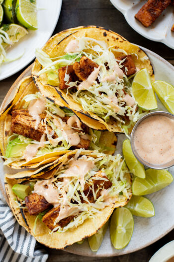 These Blackened Tofu Tacos are layered with crispy tofu, shredded cabbage, avocado and a creamy vegan sauce | ThisSavoryVegan.com