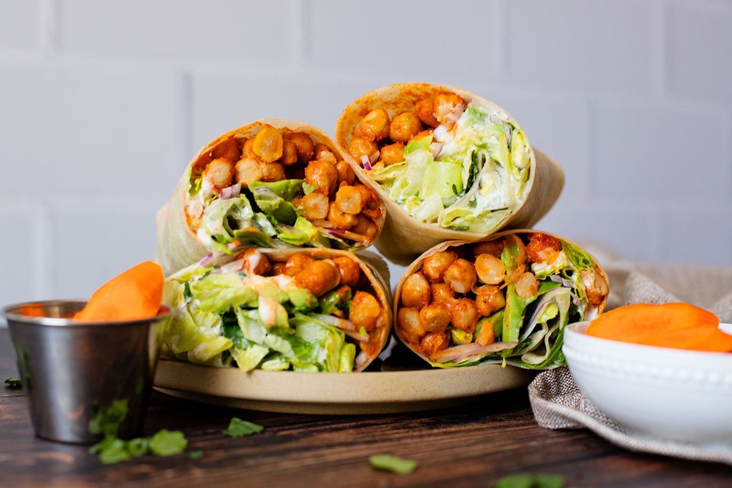 These Buffalo Chickpea Ranch Wraps are the perfect vegan lunch on the go! Buffalo chickpeas, vegan ranch & veggies wrapped in a tortilla | ThisSavoryVegan.com