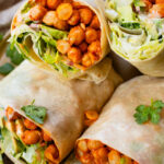 These Buffalo Chickpea Ranch Wraps are the perfect vegan lunch on the go! Buffalo chickpeas, vegan ranch & veggies wrapped in a tortilla | ThisSavoryVegan.com