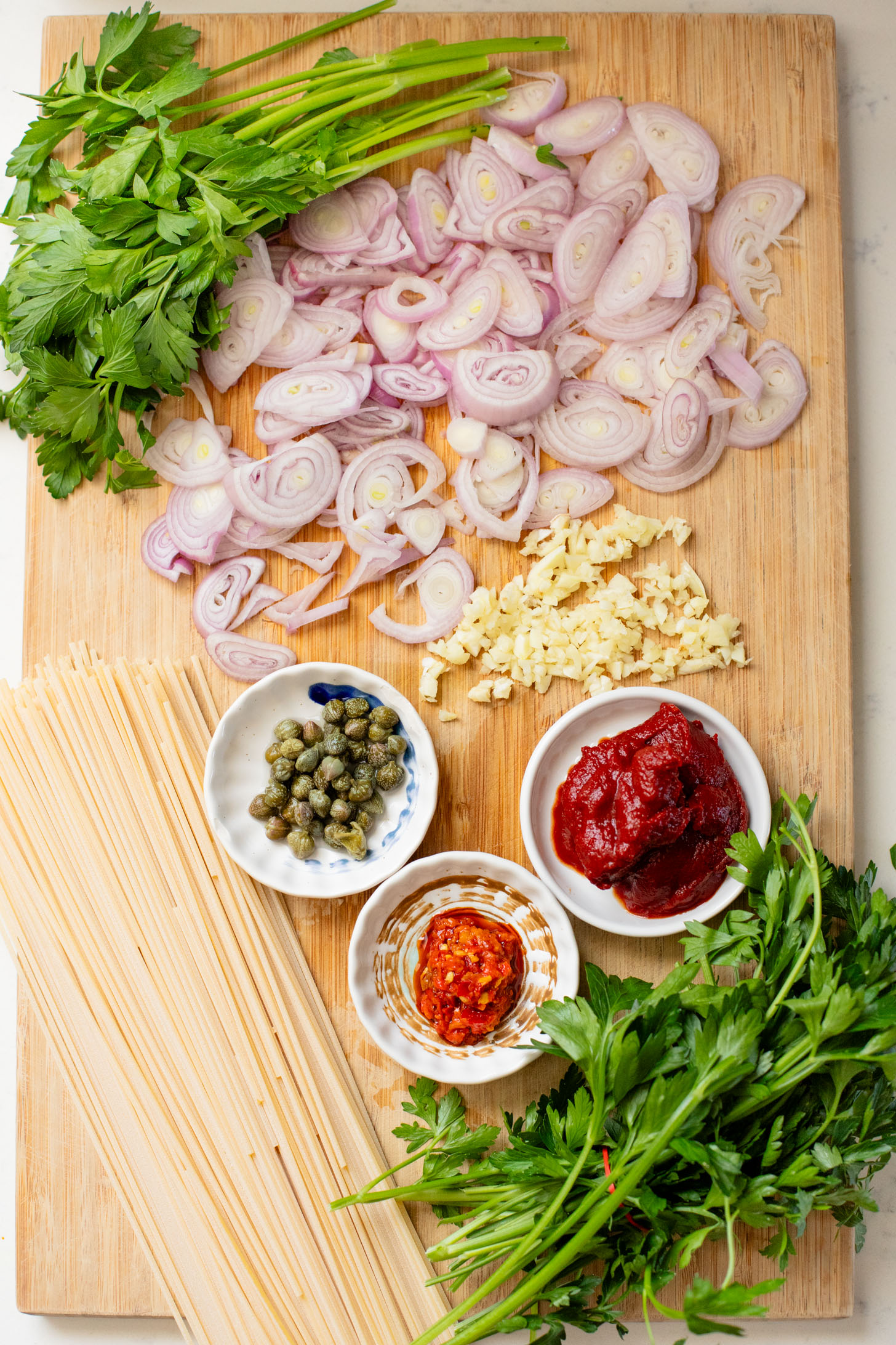 This Caramelized Shallot Pasta is creamy and delicious. Shallots are cooked down until soft and then transformed into a creamy vegan tomato sauce | ThisSavoryVegan.com