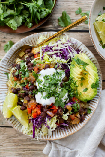These Salsa Verde Black Bean Bowls are quick, easy & tasty. The bowls are filled with quinoa, seasoned beans & lots of veggies | ThisSavoryVegan.com