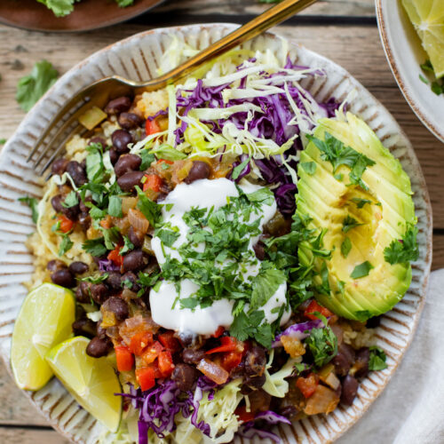These Salsa Verde Black Bean Bowls are quick, easy & tasty. The bowls are filled with quinoa, seasoned beans & lots of veggies | ThisSavoryVegan.com
