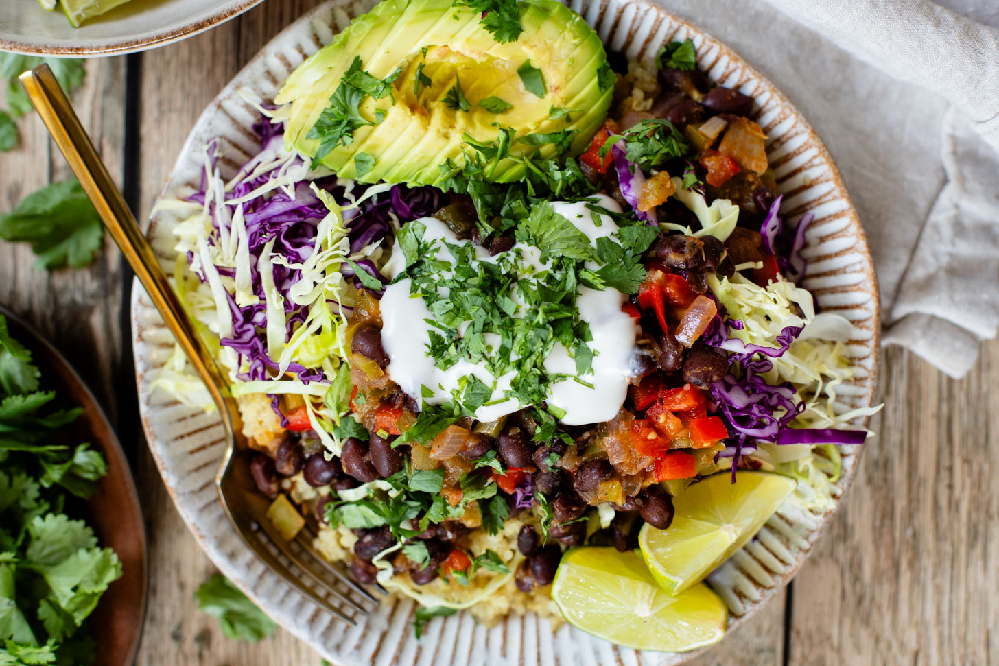 These Salsa Verde Black Bean Bowls are quick, easy & tasty. The bowls are filled with quinoa, seasoned beans & lots of veggies | ThisSavoryVegan.com