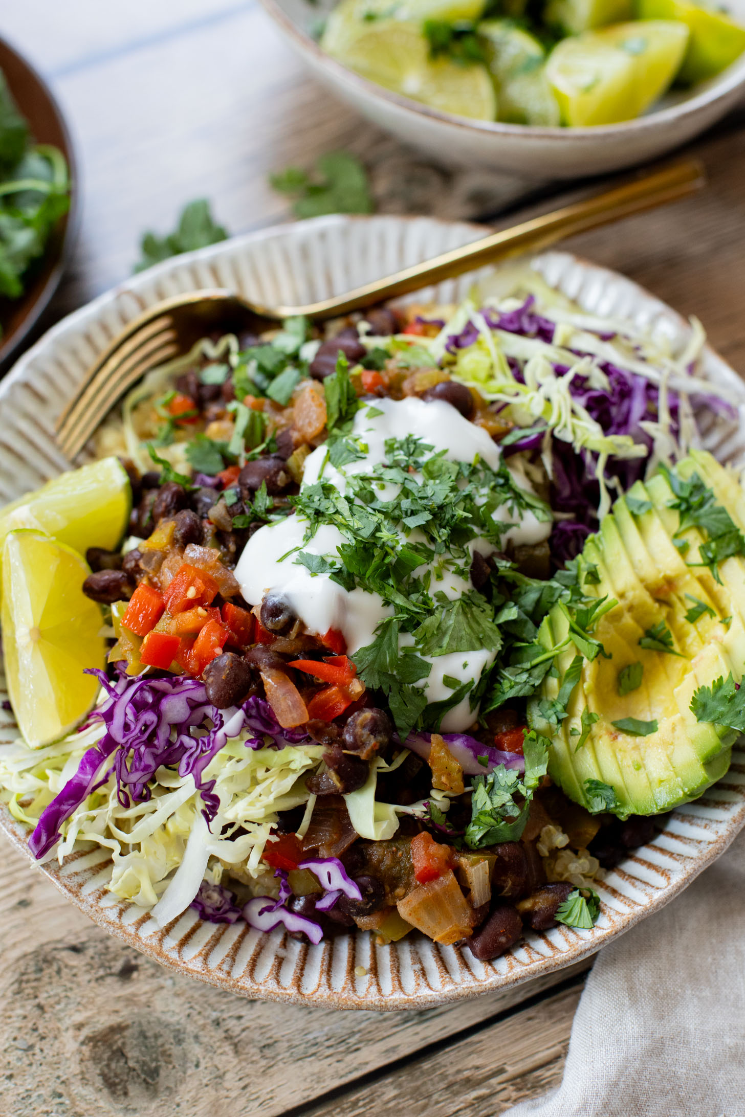 These Salsa Verde Black Bean Bowls are quick, easy & tasty. The bowls are filled with quinoa, seasoned beans & lots of veggies | ThisSavoryVegan.com