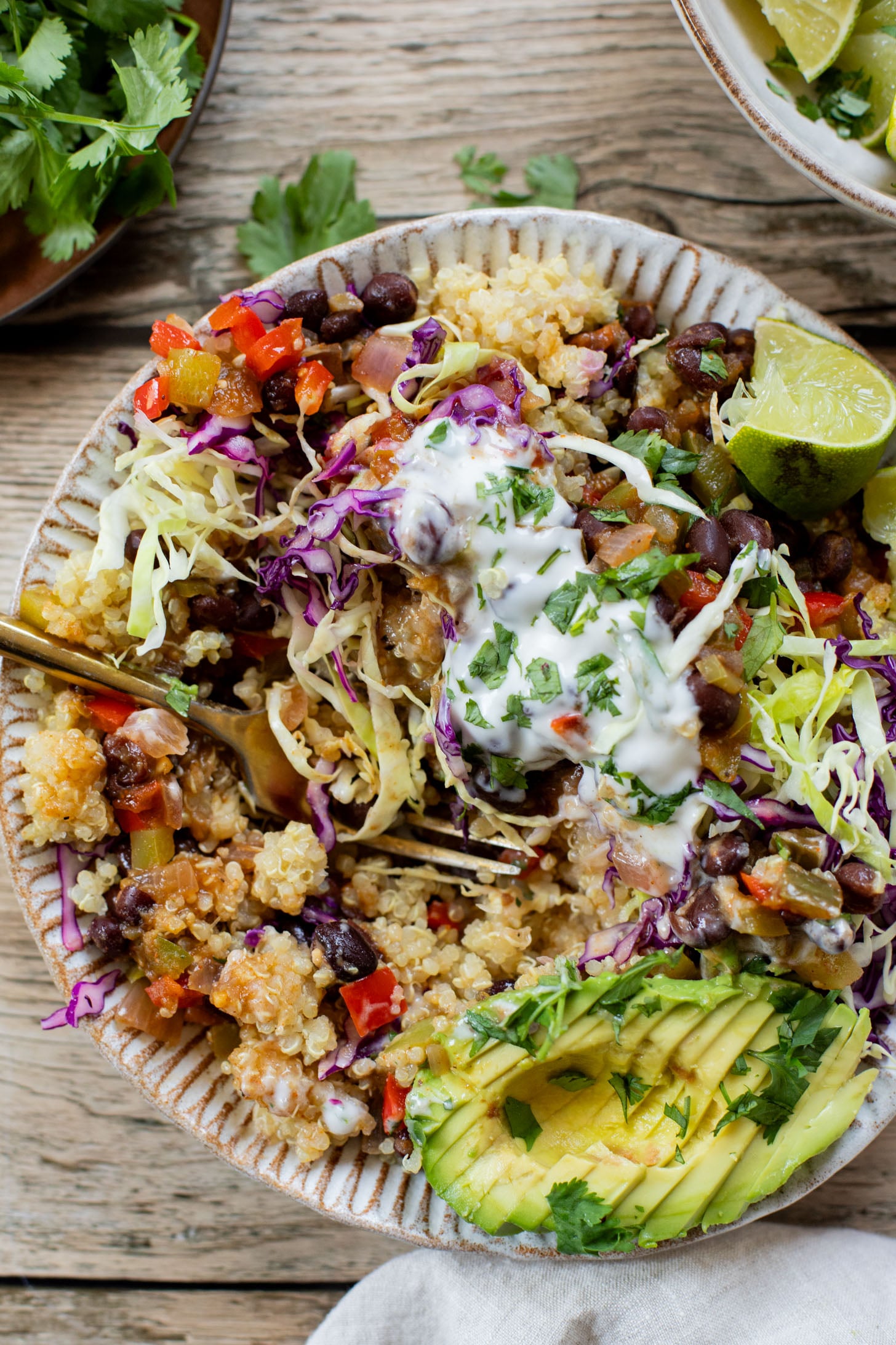 These Salsa Verde Black Bean Bowls are quick, easy & tasty. The bowls are filled with quinoa, seasoned beans & lots of veggies | ThisSavoryVegan.com
