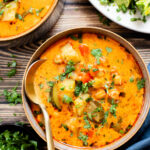 This Slow Cooker Veggie Curry Soup is a vegan dinner dream! Very little prep time, tons of veggies and zero cooking required | ThisSavoryVegan.com