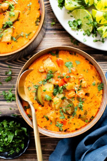 This Slow Cooker Veggie Curry Soup is a vegan dinner dream! Very little prep time, tons of veggies and zero cooking required | ThisSavoryVegan.com