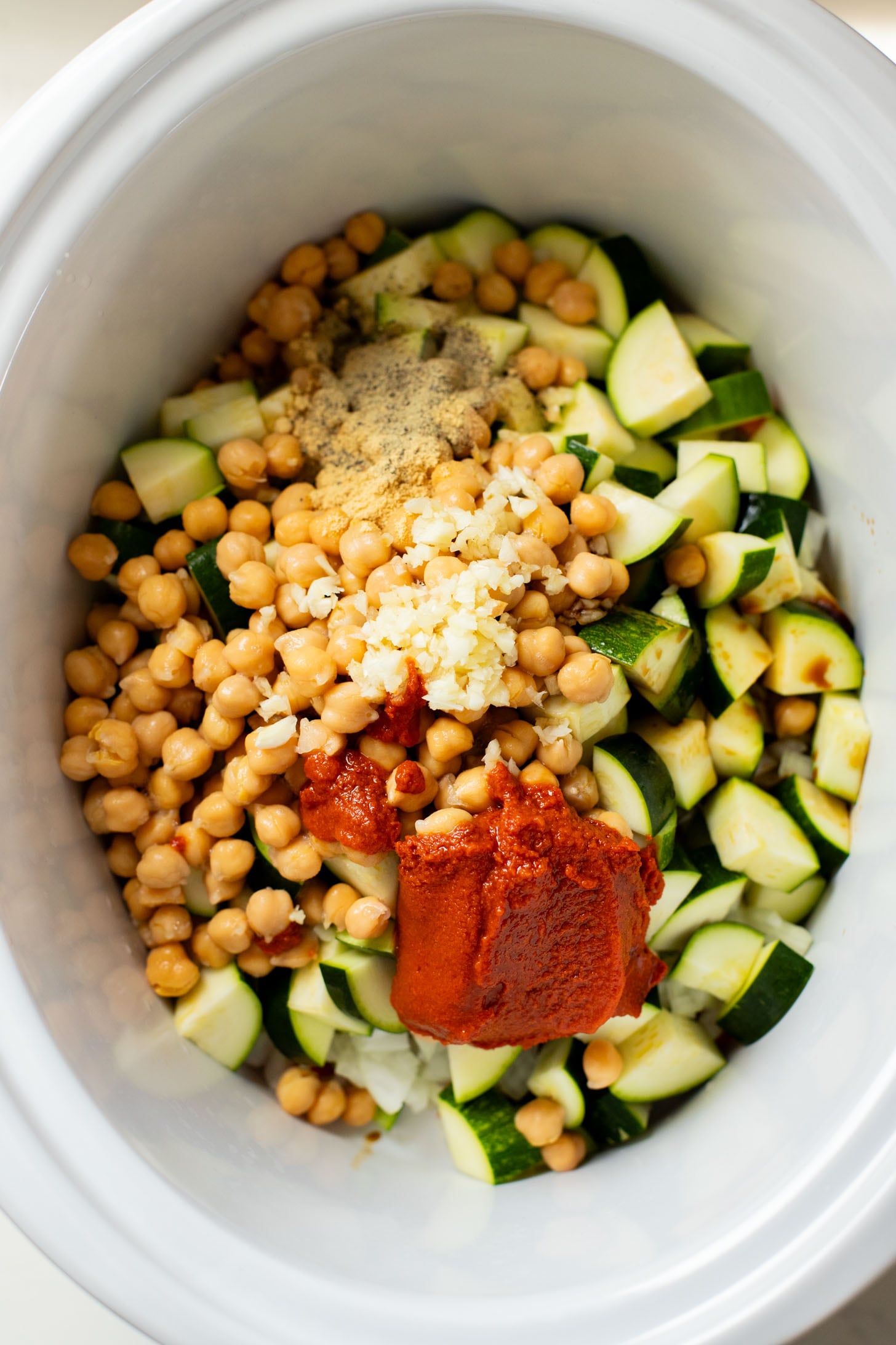 This Slow Cooker Veggie Curry Soup is a vegan dinner dream! Very little prep time, tons of veggies and zero cooking required | ThisSavoryVegan.com