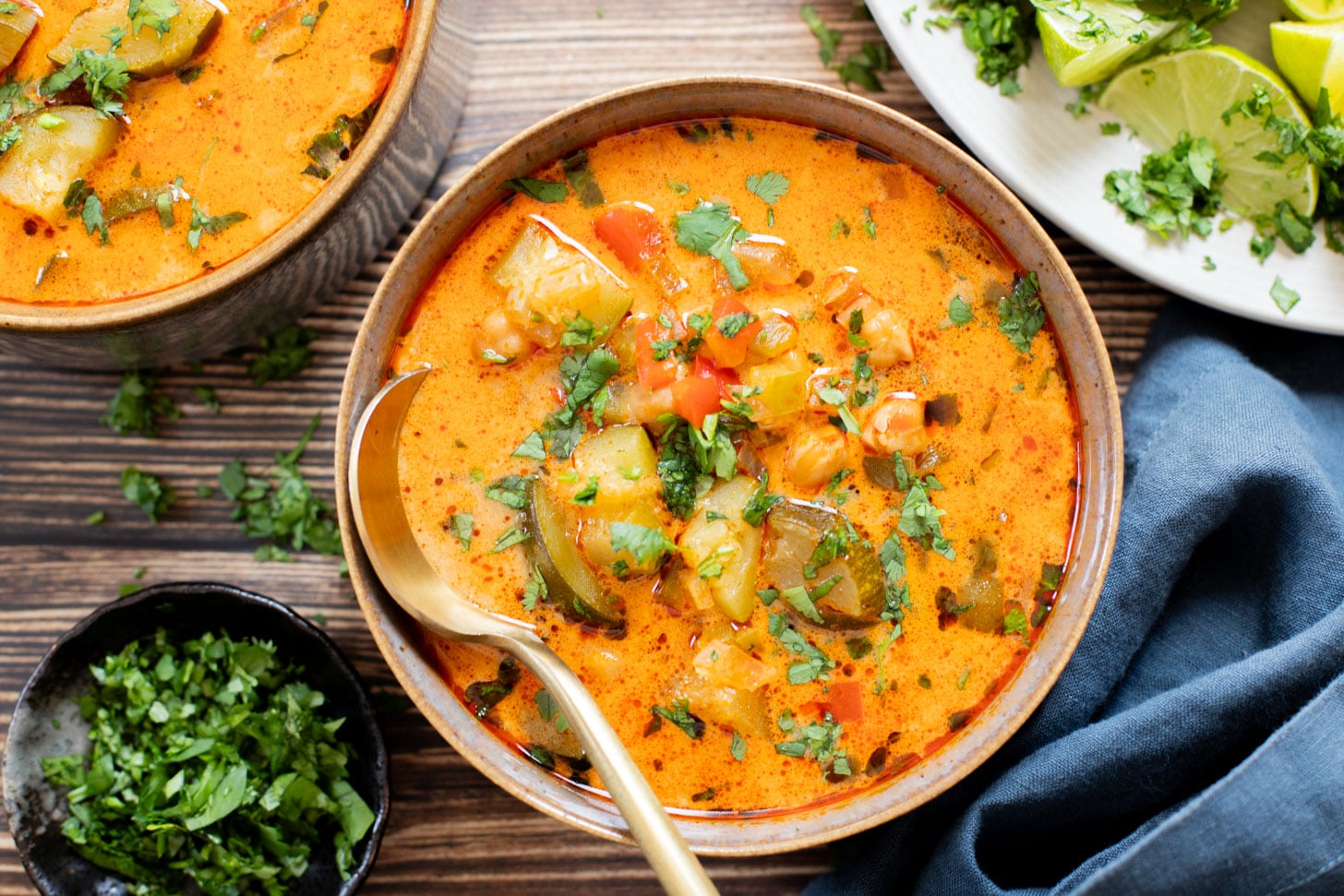 This Slow Cooker Veggie Curry Soup is a vegan dinner dream! Very little prep time, tons of veggies and zero cooking required | ThisSavoryVegan.com