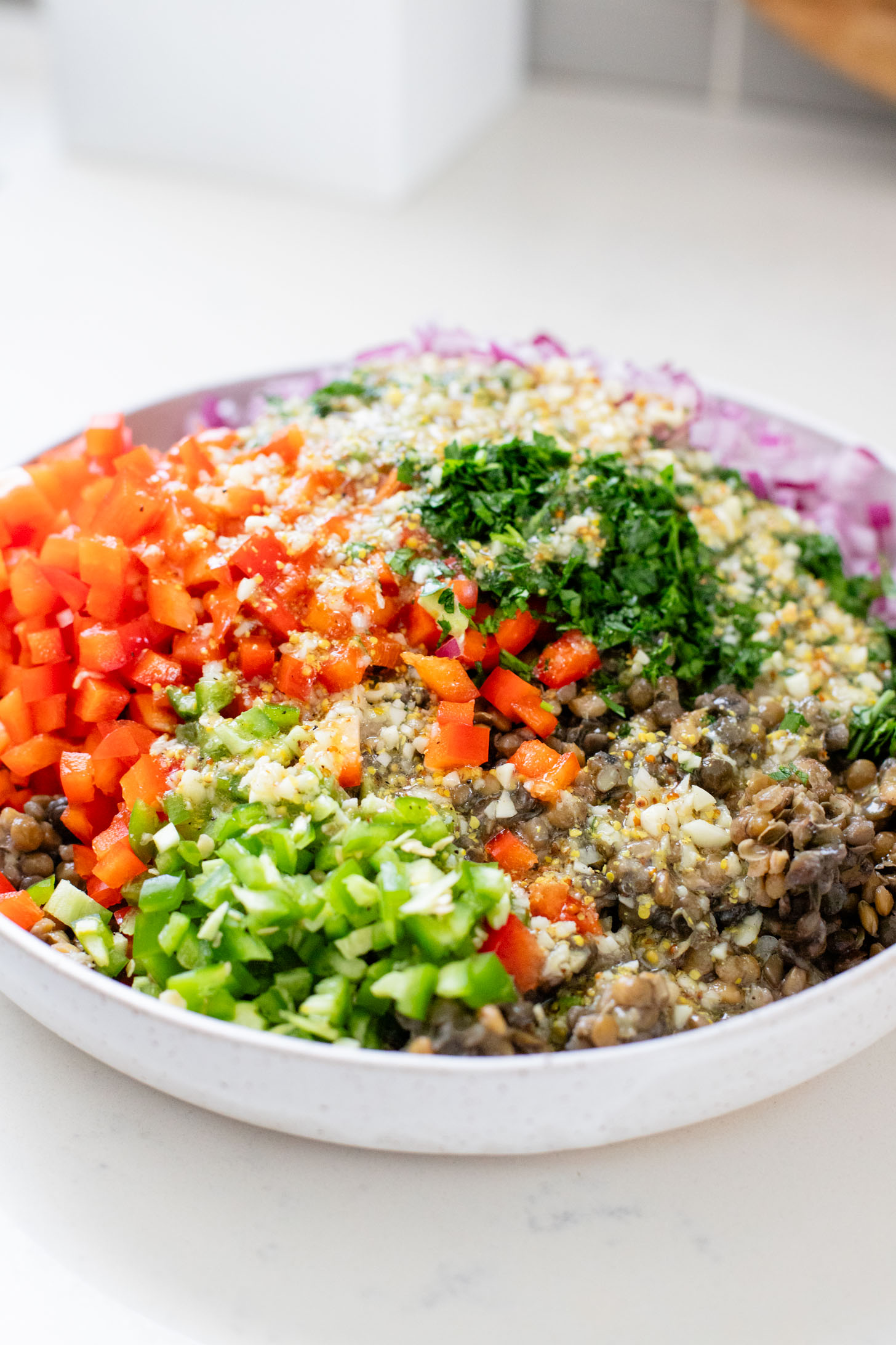 This Super Yummy Lentil Salad is ready in 15 minutes! Packed with veggies, protein and the perfect lemon garlic vinaigrette | ThisSavoryVegan.com