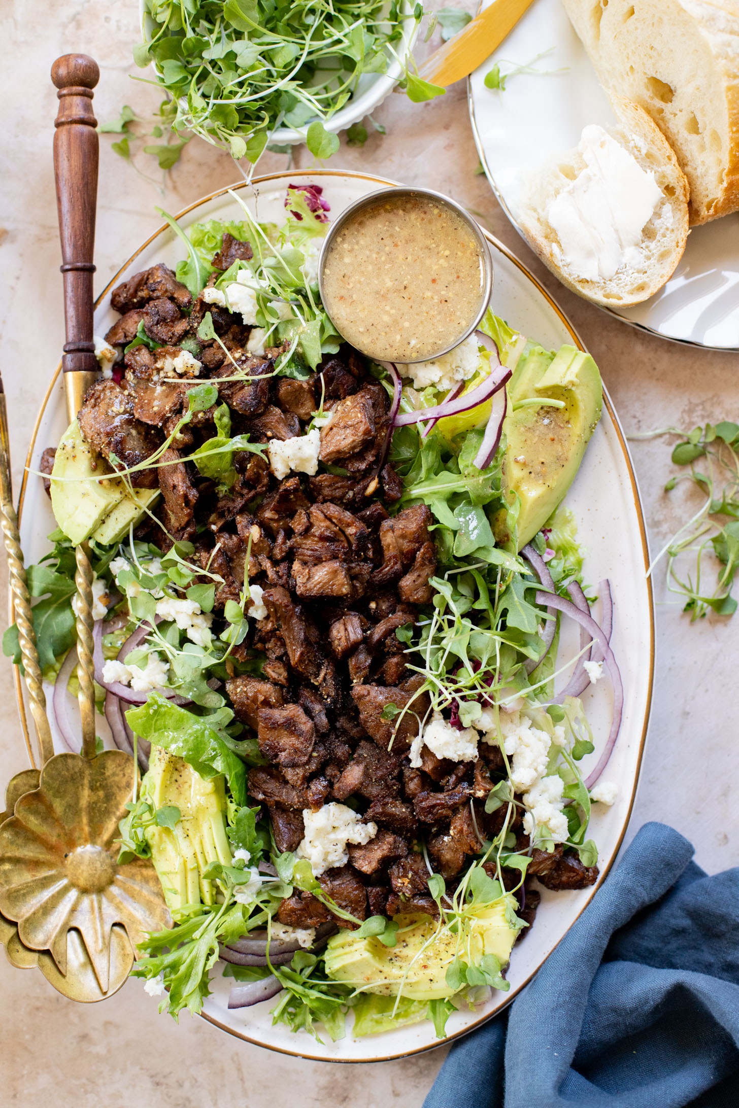 This Vegan Steak Salad is easy, protein-packed and delicious! Served with a simple vinaigrette, vegan cheese, avocado & red onion | ThisSavoryVegan.com
