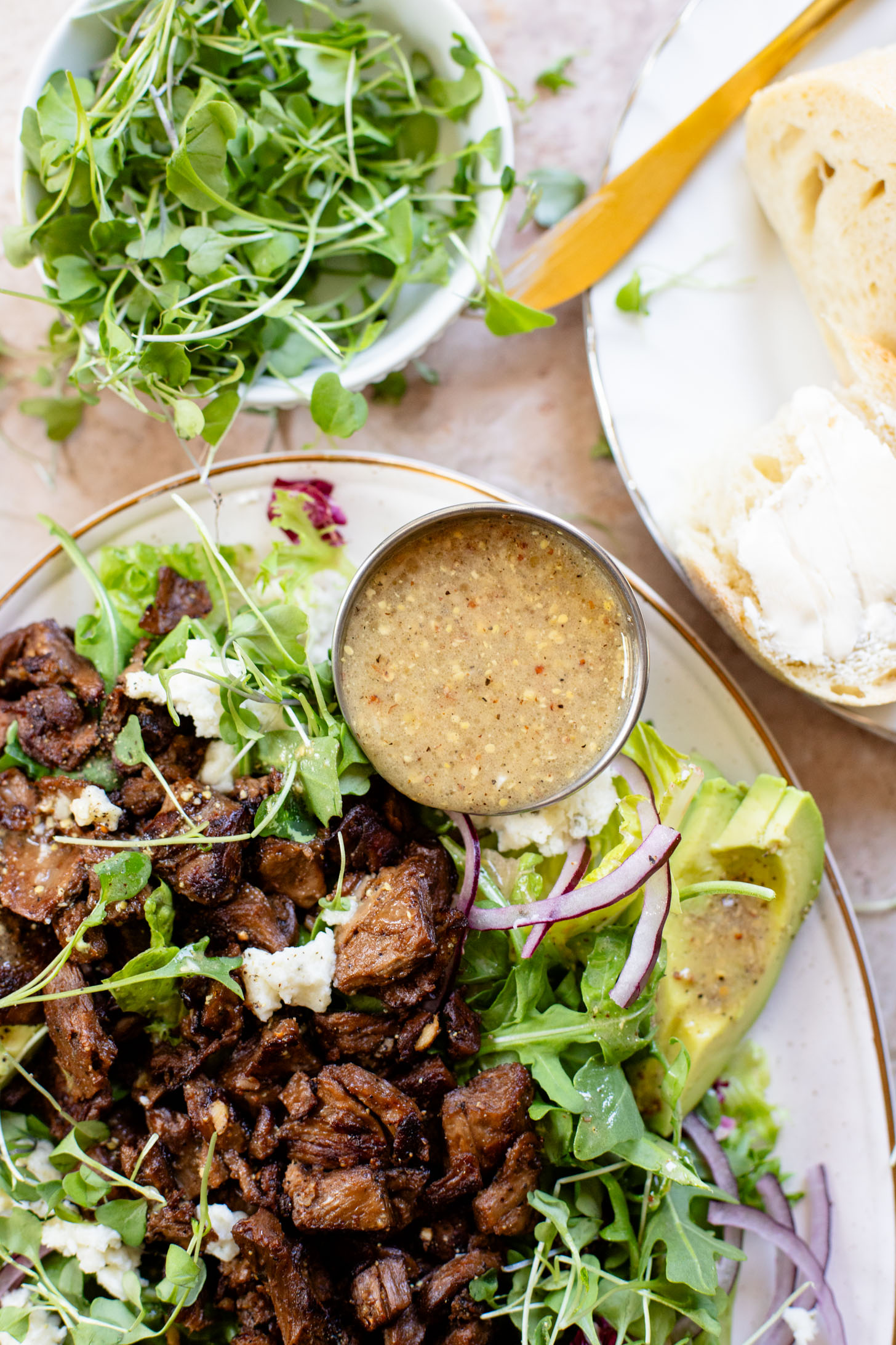 This Vegan Steak Salad is easy, protein-packed and delicious! Served with a simple vinaigrette, vegan cheese, avocado & red onion | ThisSavoryVegan.com