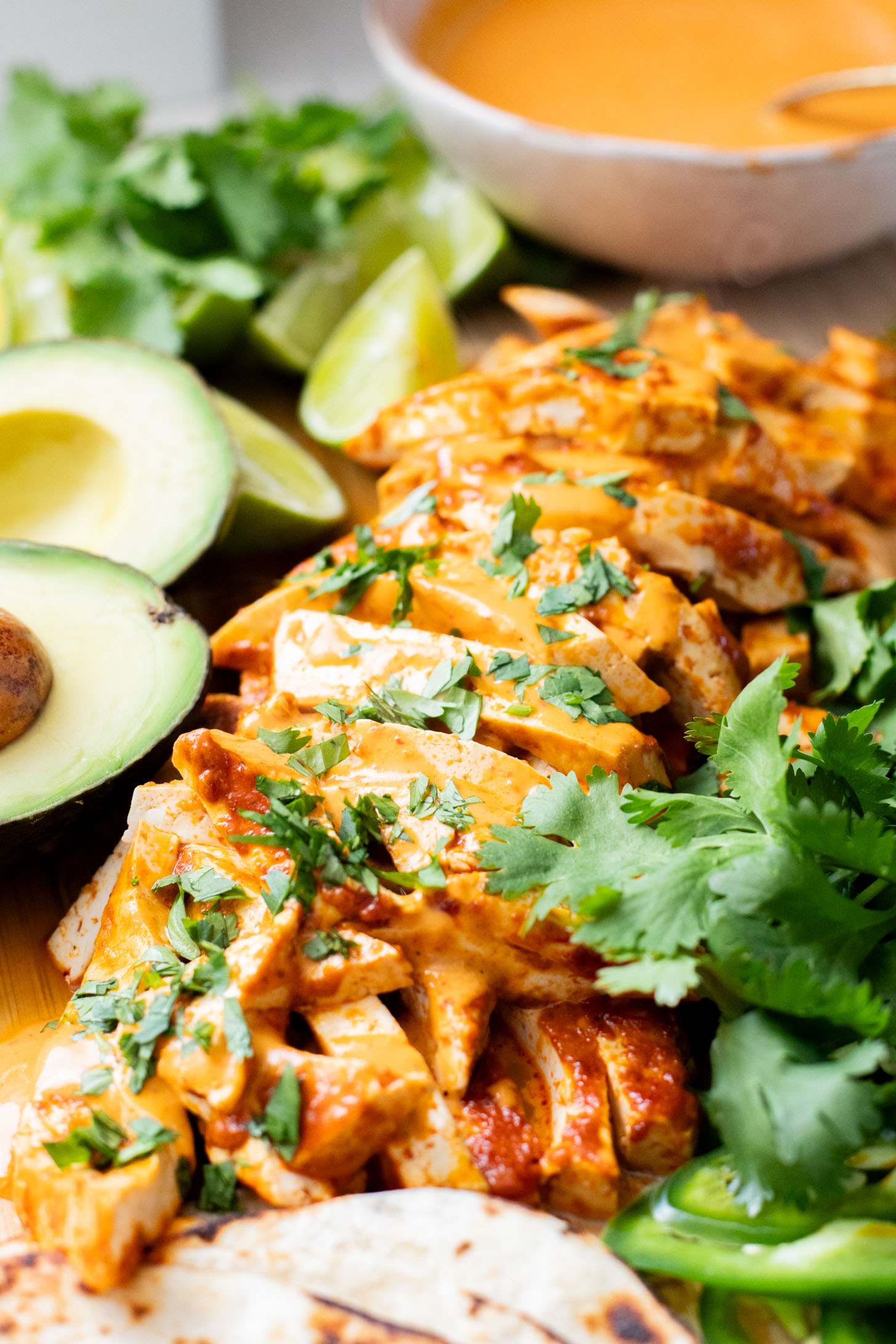 These Baked Chipotle Tofu Tacos are layered with marinated & baked tofu, cabbage, cilantro & a creamy dairy-free chipotle sauce | ThisSavoryVegan.com