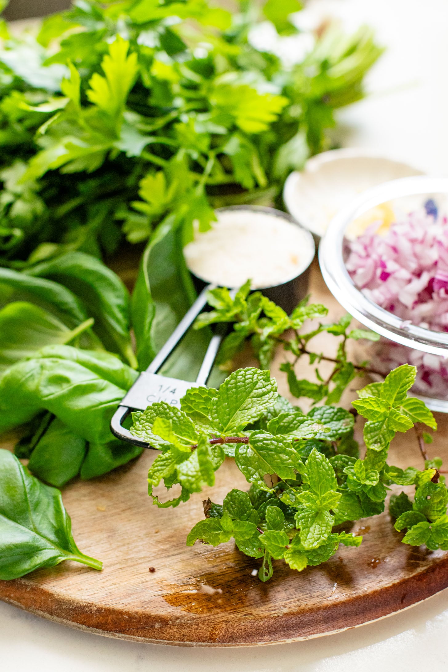 This Lemon Herb Couscous Salad is packed with fresh herbs, chickpeas, vegan parmesan and a simple & delicious dressing | ThisSavoryVegan.com