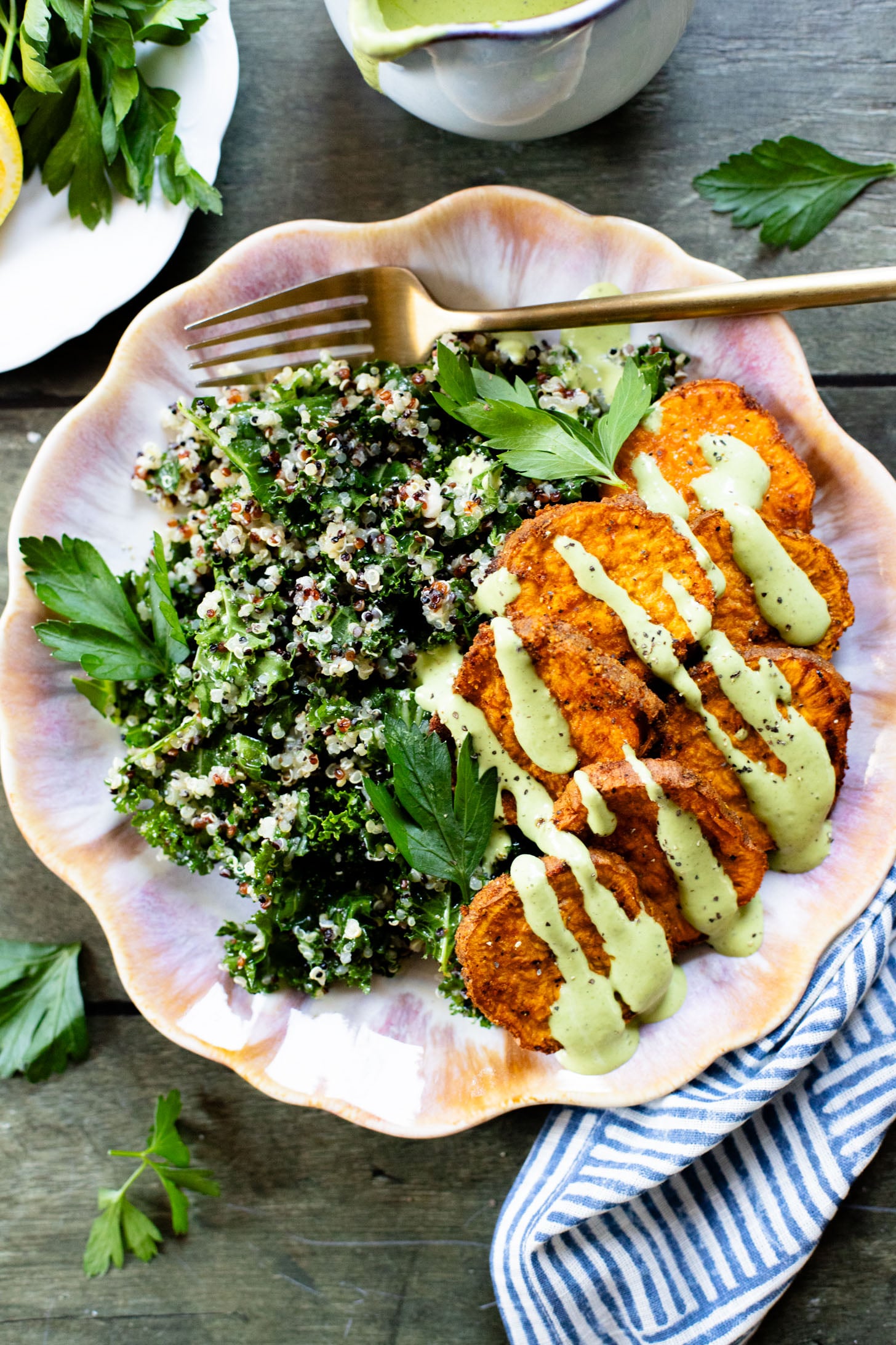 These Lemon Herb Sweet Potato Quinoa Bowls are healthy and tasty! Quinoa & kale salad is topped with roasted sweet potatoes & basil dressing | ThisSavoryVegan.com