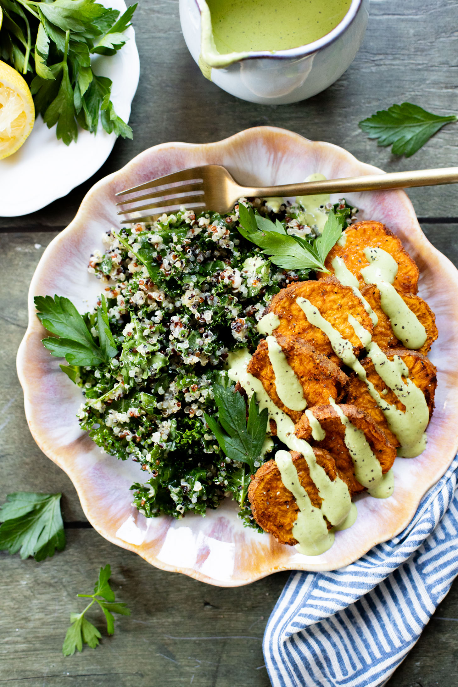 These Lemon Herb Sweet Potato Quinoa Bowls are healthy and tasty! Quinoa & kale salad is topped with roasted sweet potatoes & basil dressing | ThisSavoryVegan.com