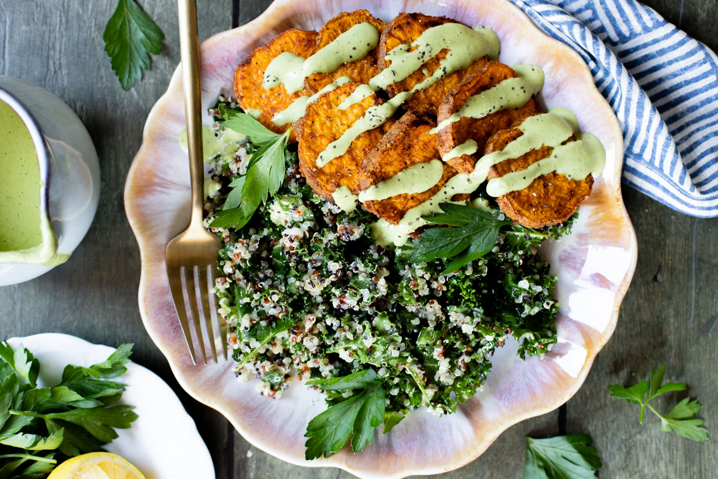 These Lemon Herb Sweet Potato Quinoa Bowls are healthy and tasty! Quinoa & kale salad is topped with roasted sweet potatoes & basil dressing | ThisSavoryVegan.com