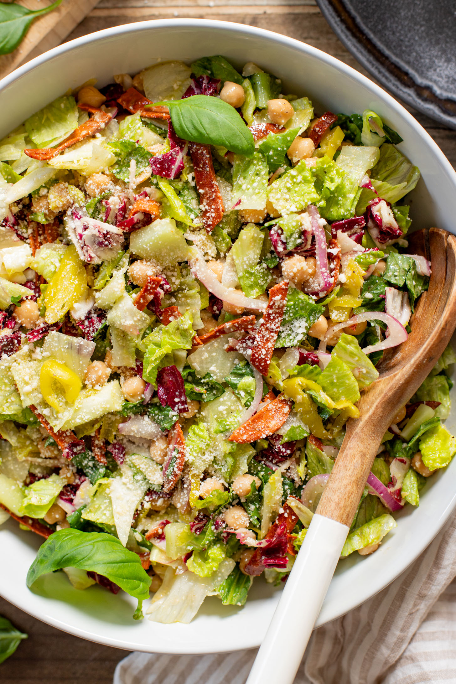 This Pizza Night Chopped Salad is the perfect side for, you guessed it, pizza night! Crunchy veggies, vegan pepperoni & a tangy dressing | ThisSavoryVegan.com