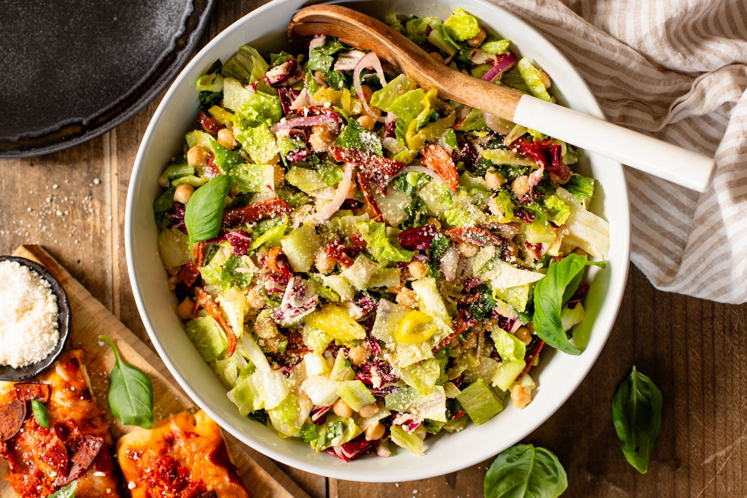 This Pizza Night Chopped Salad is the perfect side for, you guessed it, pizza night! Crunchy veggies, vegan pepperoni & a tangy dressing | ThisSavoryVegan.com