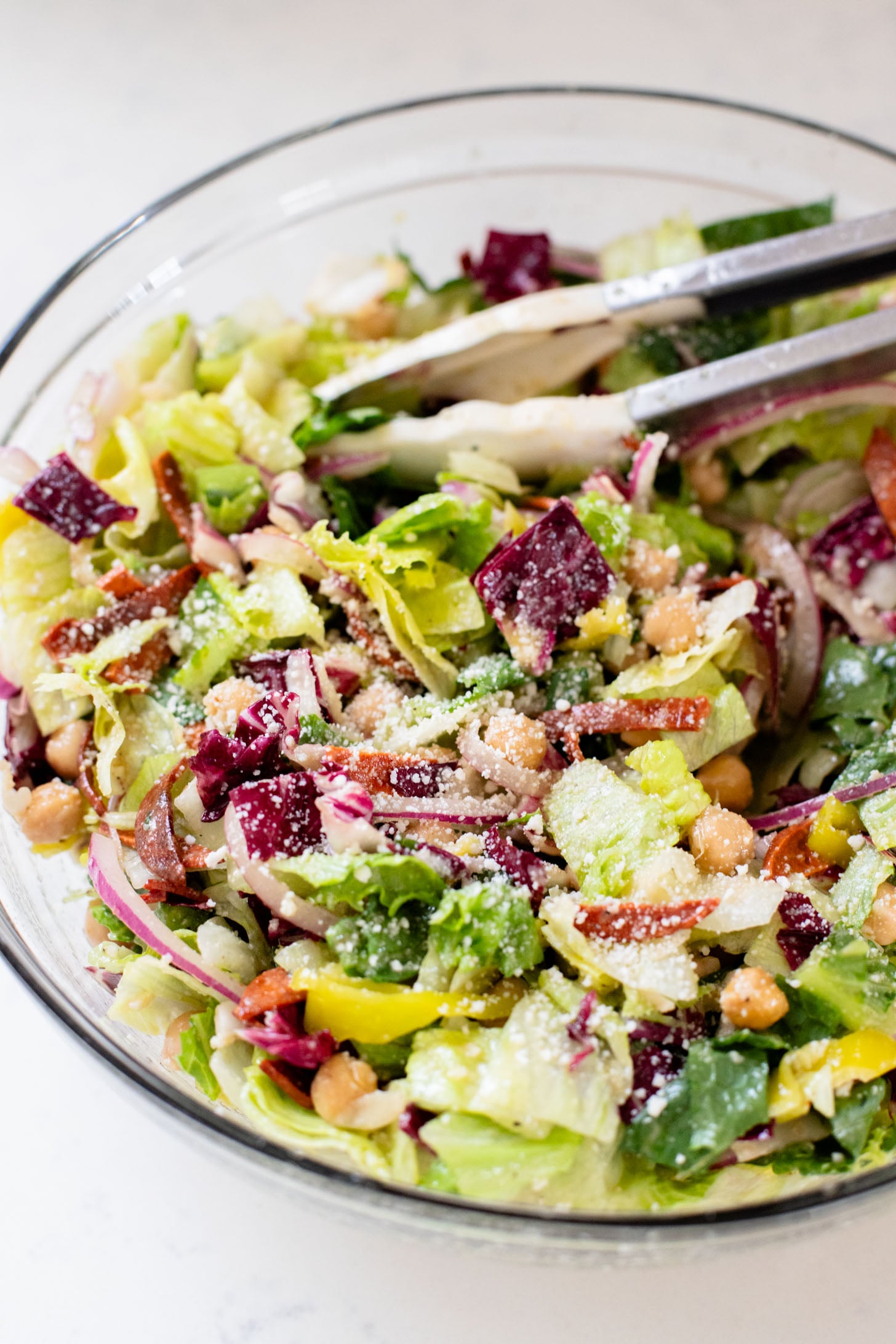 This Pizza Night Chopped Salad is the perfect side for, you guessed it, pizza night! Crunchy veggies, vegan pepperoni & a tangy dressing | ThisSavoryVegan.com