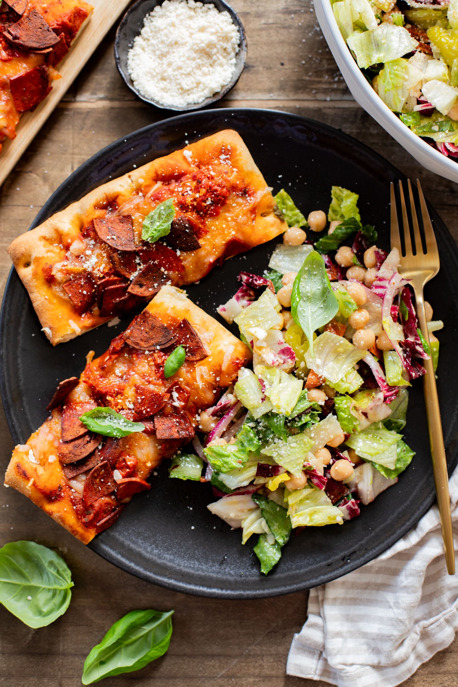 This Pizza Night Chopped Salad is the perfect side for, you guessed it, pizza night! Crunchy veggies, vegan pepperoni & a tangy dressing | ThisSavoryVegan.com