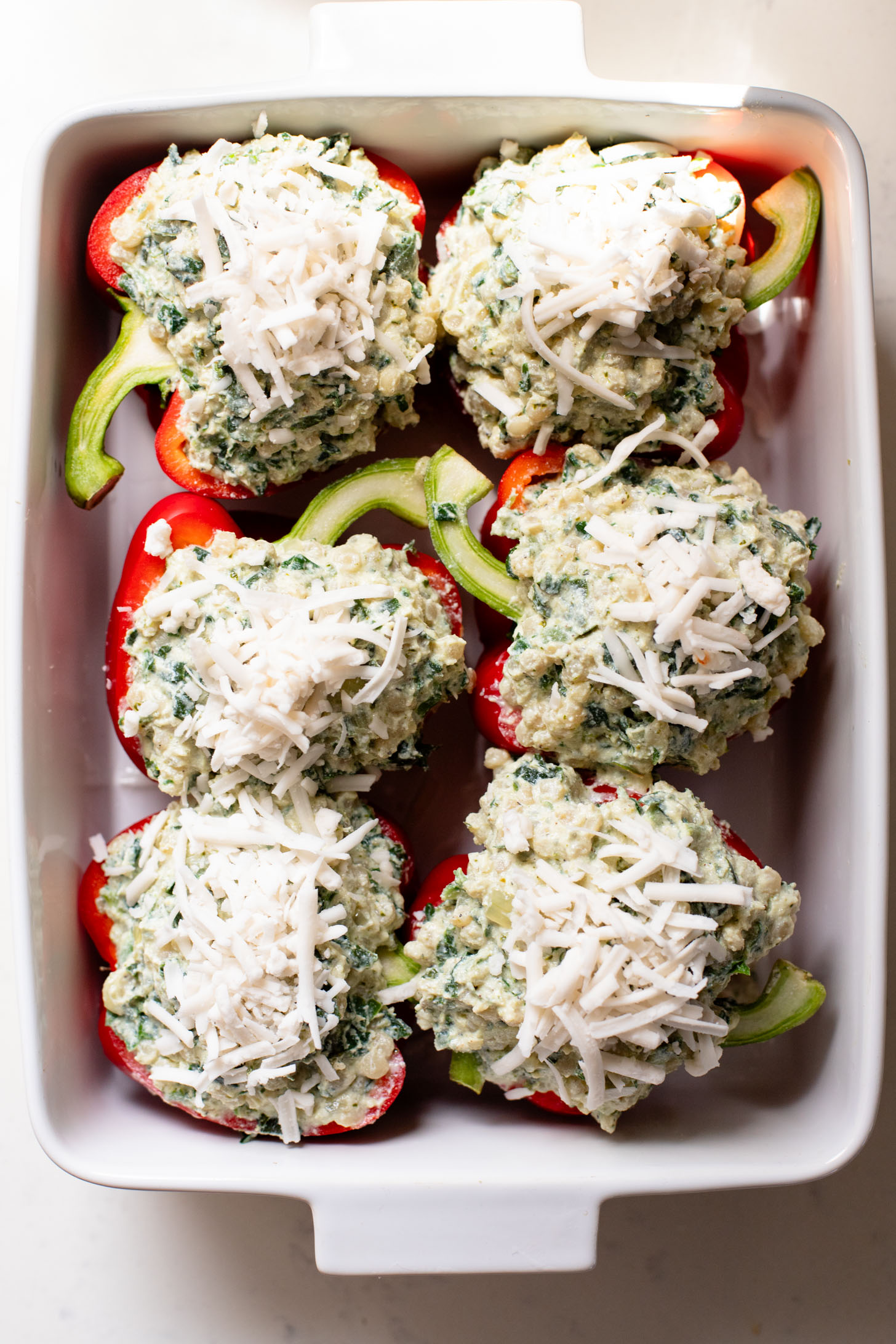These Ricotta Couscous Stuffed Peppers are dairy-free, creamy deliciousness! A protein-packed vegan dinner idea | ThisSavoryVegan.com