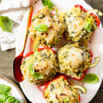 These Ricotta Couscous Stuffed Peppers are dairy-free, creamy deliciousness! A protein-packed vegan dinner idea | ThisSavoryVegan.com