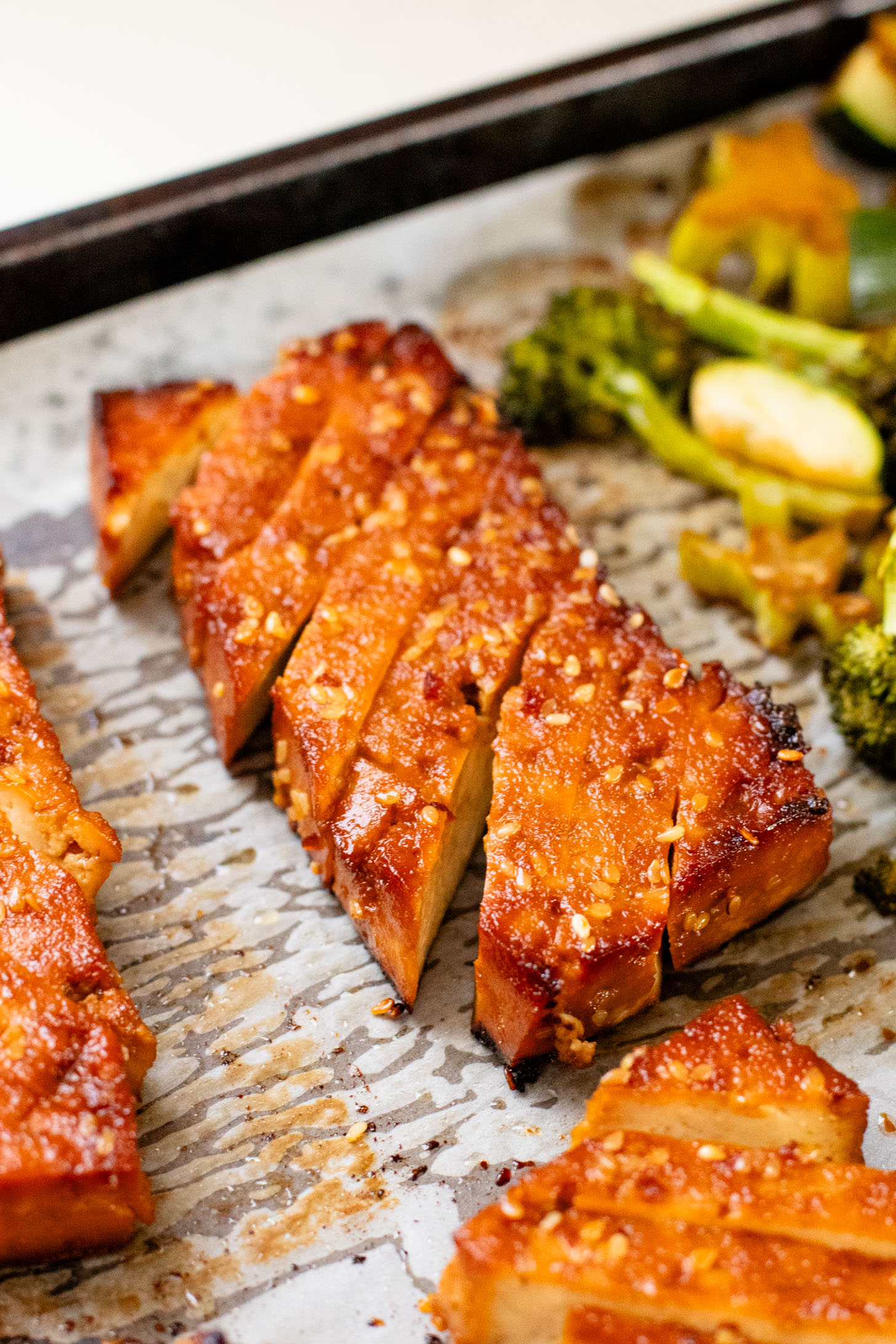 A quick & easy vegan weeknight dinner, this Sheet Pan Soyaki Tofu has marinated tofu & crispy veggies all made on one pan | ThisSavoryVegan.com