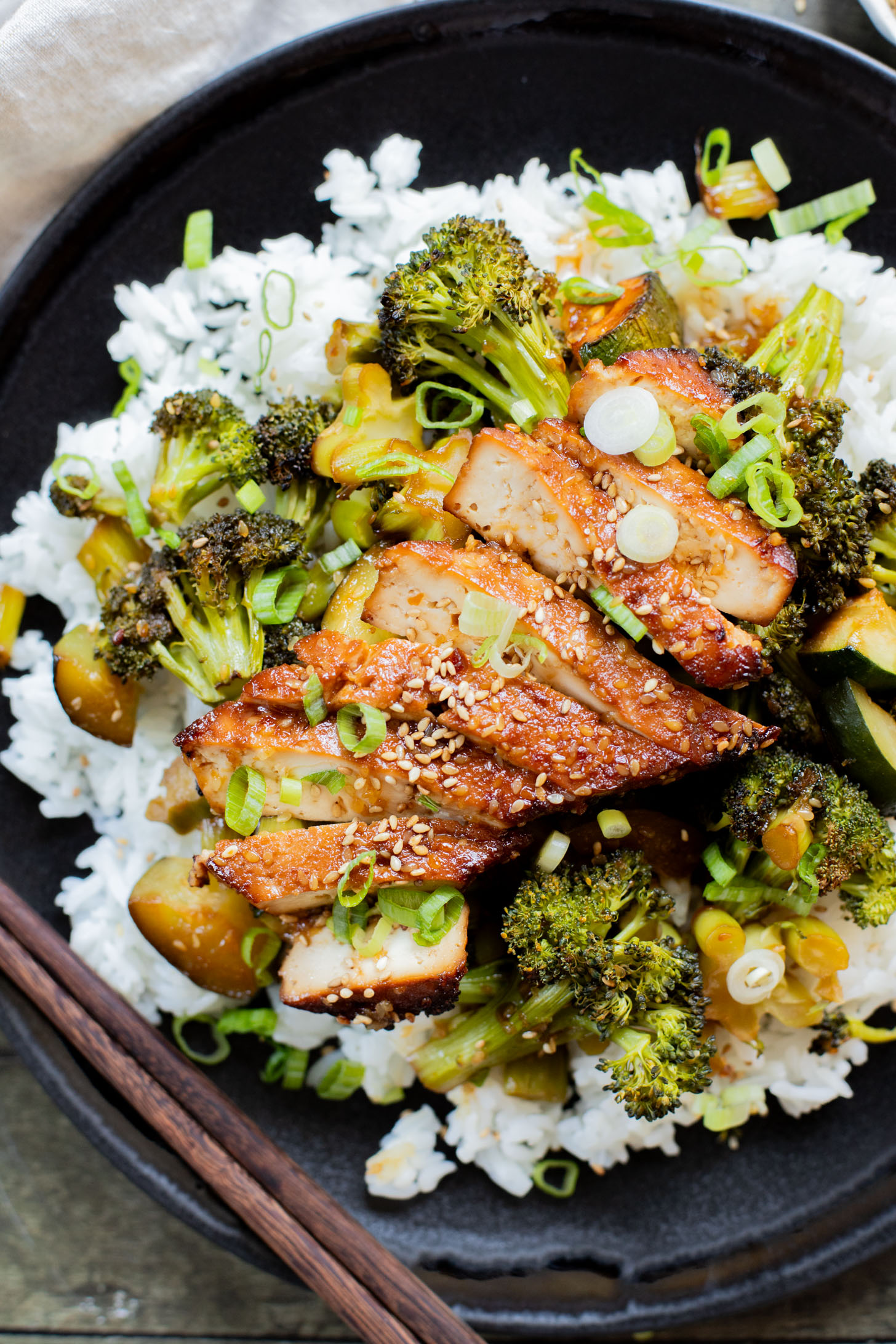 A quick & easy vegan weeknight dinner, this Sheet Pan Soyaki Tofu has marinated tofu & crispy veggies all made on one pan | ThisSavoryVegan.com