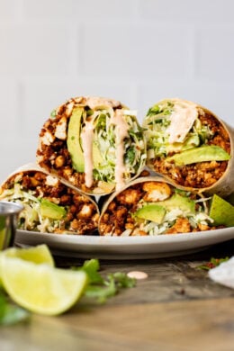 These Sheet Pan Tofu Burritos are filled with crispy tofu, shredded cabbage, cilantro, onions, avocado and dairy-free chipotle mayo | ThisSavoryVegan.com