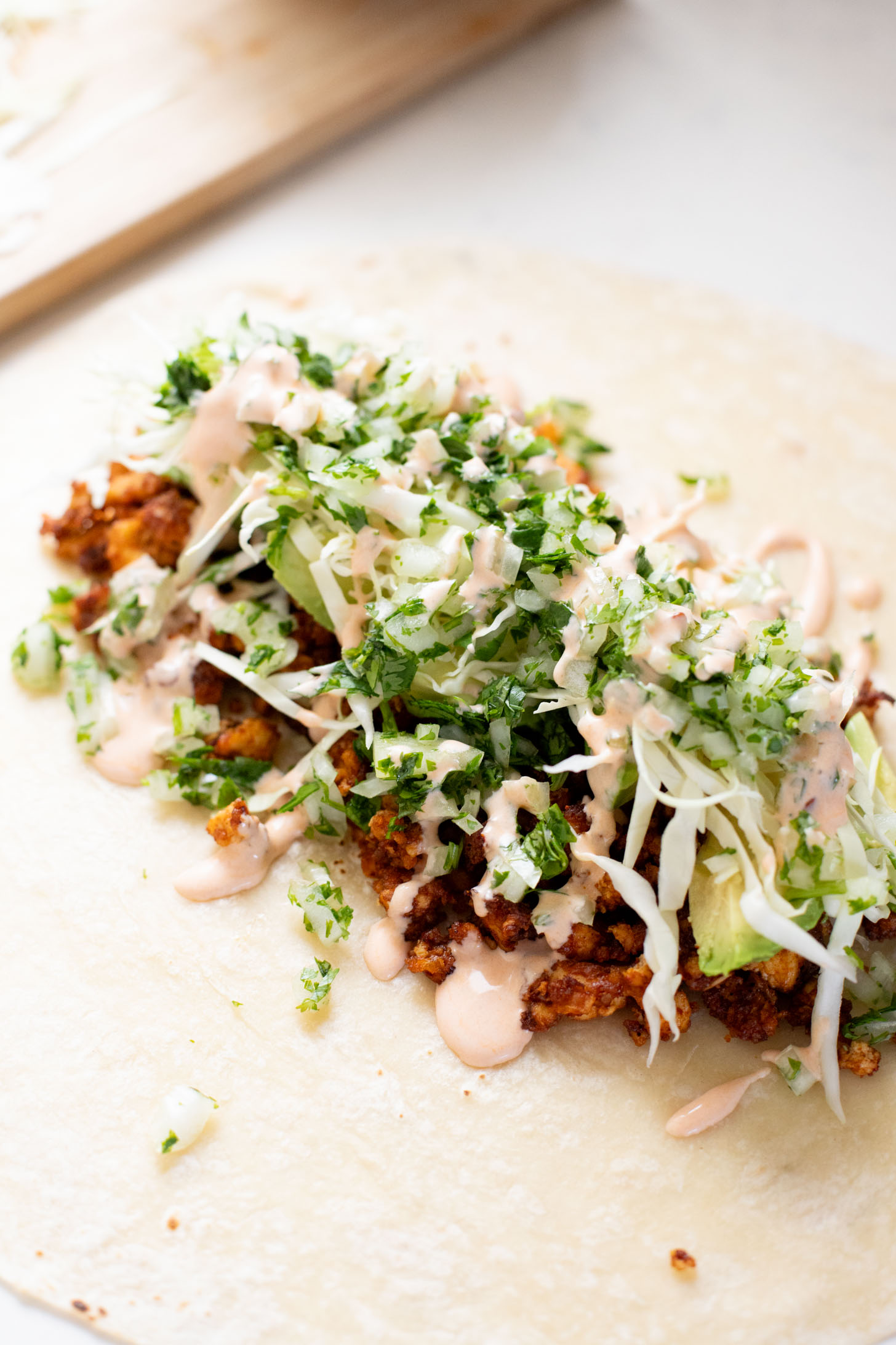 These Sheet Pan Tofu Burritos are filled with crispy tofu, shredded cabbage, cilantro, onions, avocado and dairy-free chipotle mayo | ThisSavoryVegan.com
