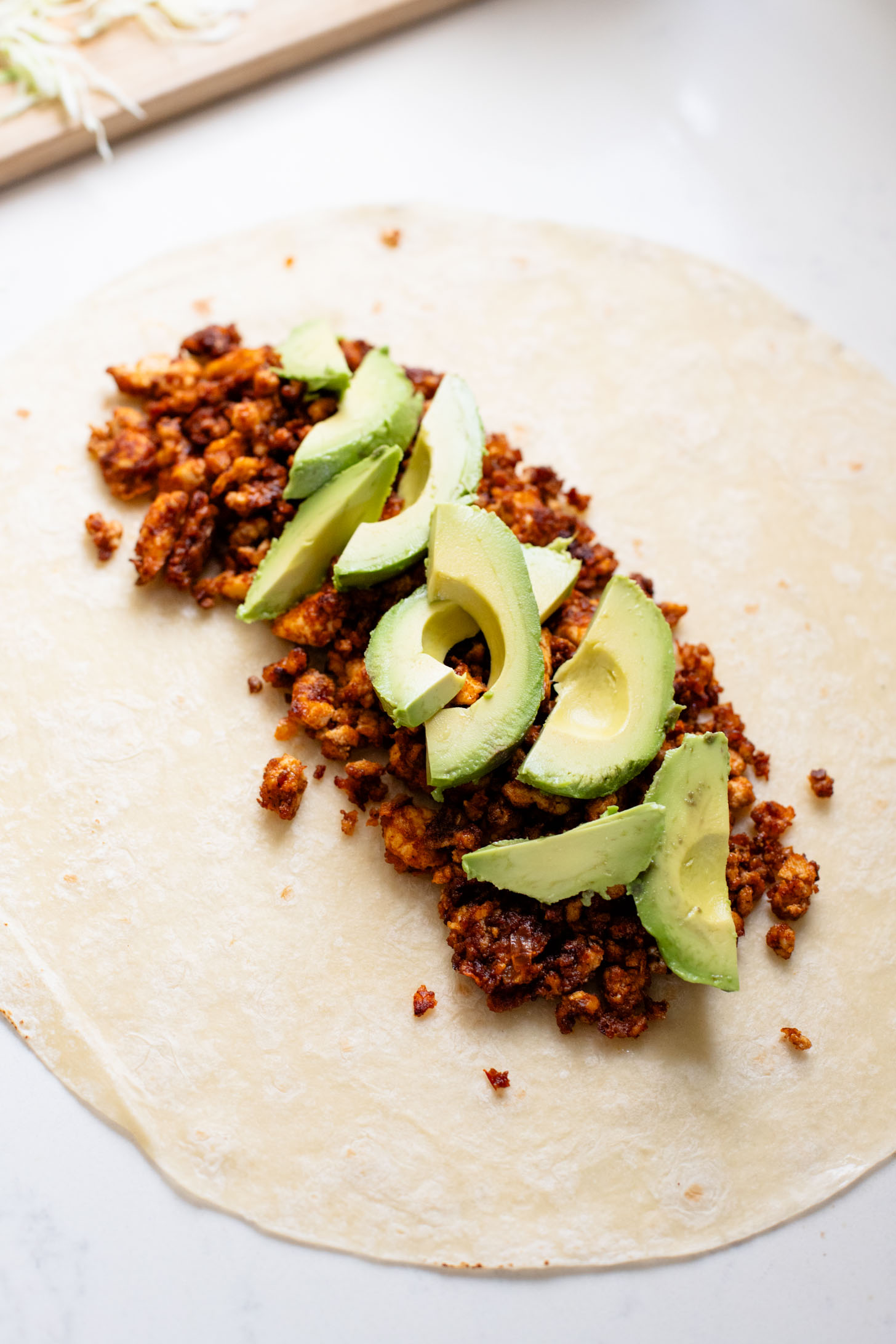 These Sheet Pan Tofu Burritos are filled with crispy tofu, shredded cabbage, cilantro, onions, avocado and dairy-free chipotle mayo | ThisSavoryVegan.com
