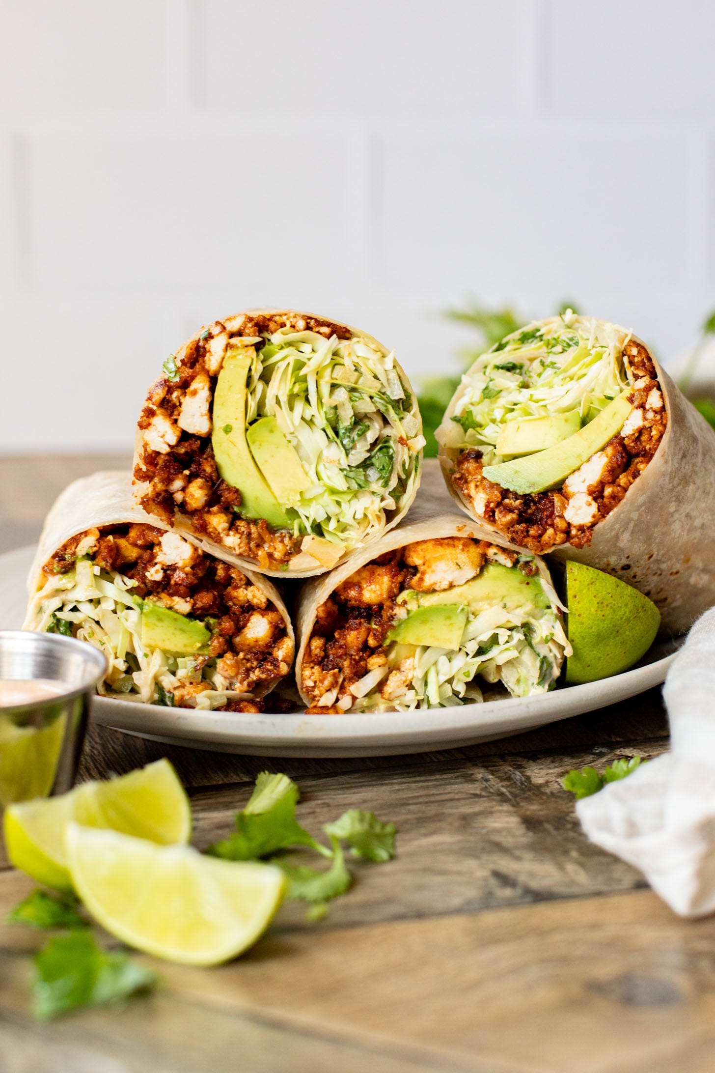 These Sheet Pan Tofu Burritos are filled with crispy tofu, shredded cabbage, cilantro, onions, avocado and dairy-free chipotle mayo | ThisSavoryVegan.com