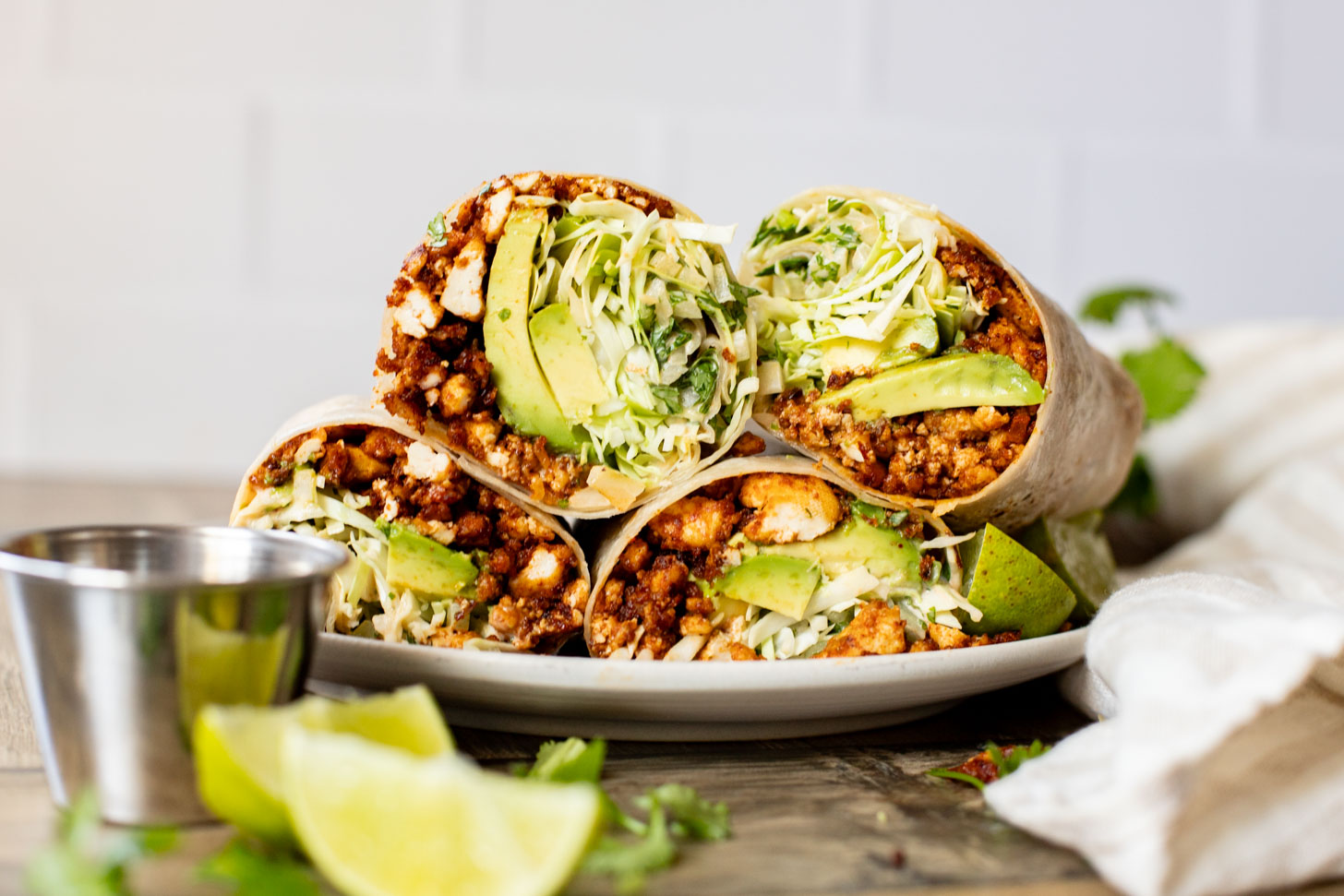 These Sheet Pan Tofu Burritos are filled with crispy tofu, shredded cabbage, cilantro, onions, avocado and dairy-free chipotle mayo | ThisSavoryVegan.com