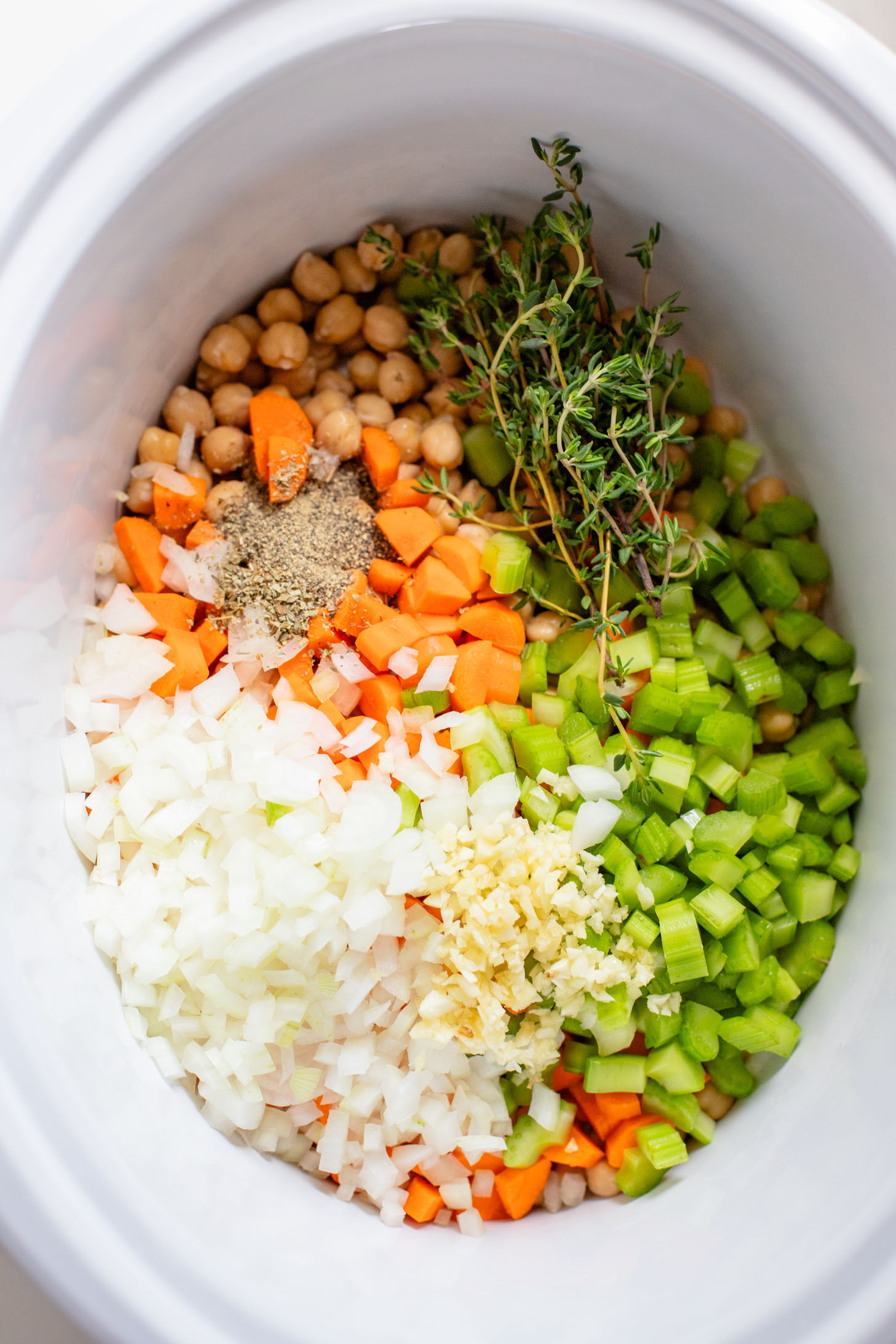 This Slow Cooker Chickpea Noodle Soup is comfort in a bowl. A vegan twist on chicken noodle soup...that tastes even better | ThisSavoryVegan.com