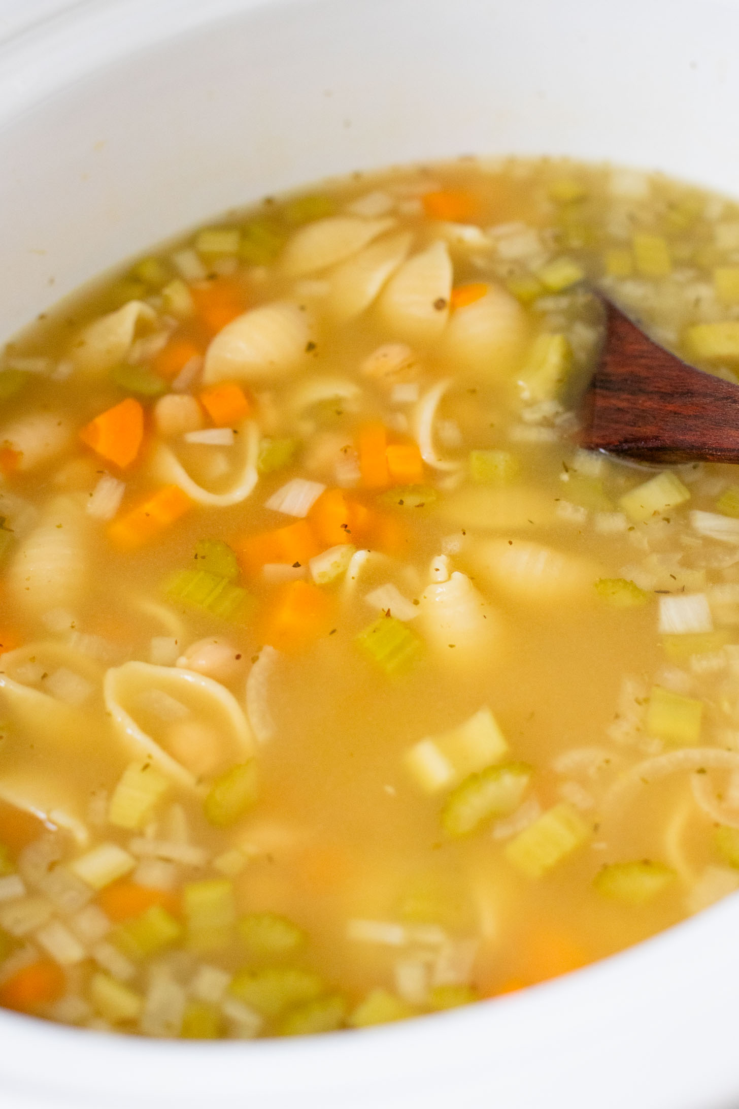 This Slow Cooker Chickpea Noodle Soup is comfort in a bowl. A vegan twist on chicken noodle soup...that tastes even better | ThisSavoryVegan.com