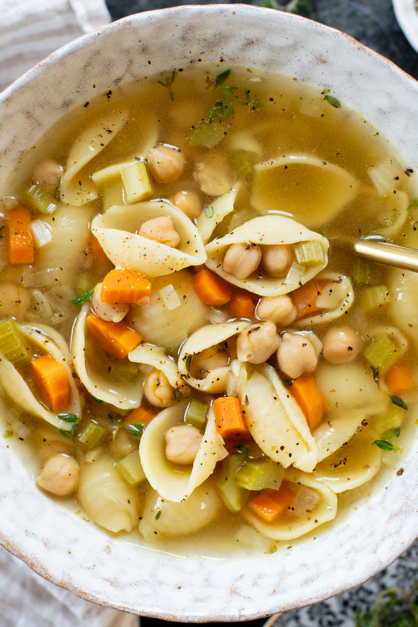 This Slow Cooker Chickpea Noodle Soup is comfort in a bowl. A vegan twist on chicken noodle soup...that tastes even better | ThisSavoryVegan.com