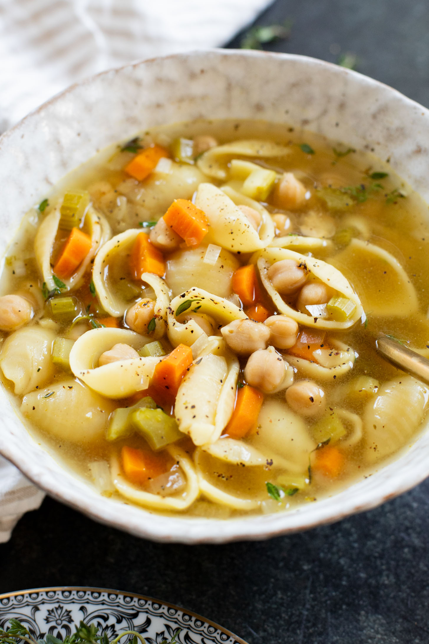 This Slow Cooker Chickpea Noodle Soup is comfort in a bowl. A vegan twist on chicken noodle soup...that tastes even better | ThisSavoryVegan.com