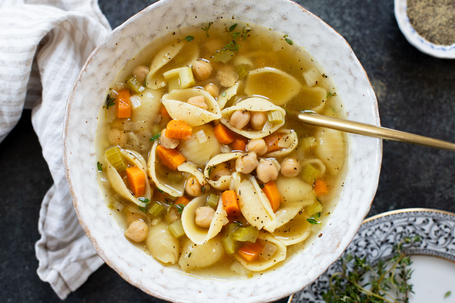This Slow Cooker Chickpea Noodle Soup is comfort in a bowl. A vegan twist on chicken noodle soup...that tastes even better | ThisSavoryVegan.com