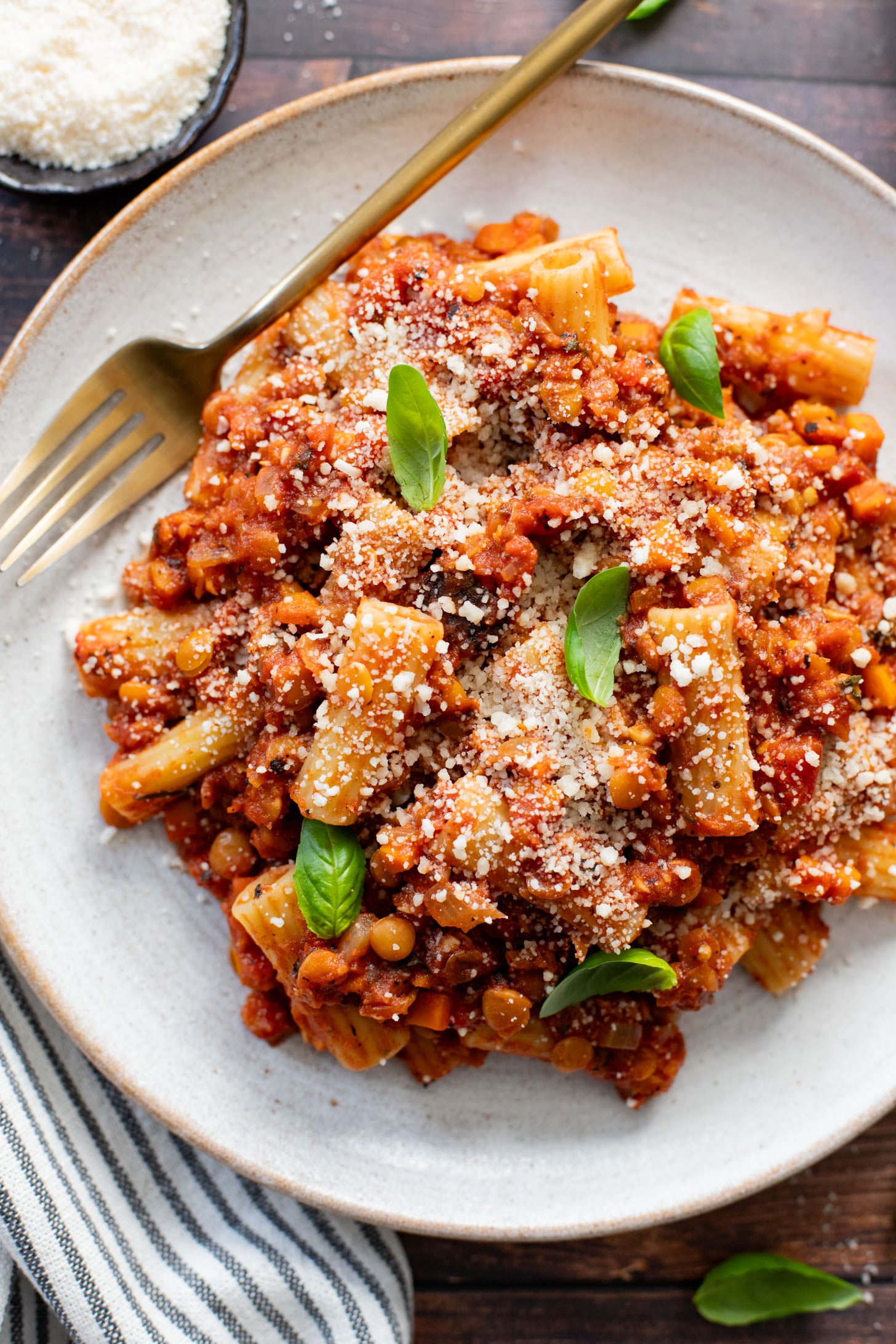 This Slow Cooker Lentil Bolognese is the perfect vegan Sunday sauce! Served over pasta for a delicious, protein-packed dinner idea | ThisSavoryVegan.com