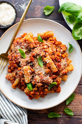 This Slow Cooker Lentil Bolognese is the perfect vegan Sunday sauce! Served over pasta for a delicious, protein-packed dinner idea | ThisSavoryVegan.com