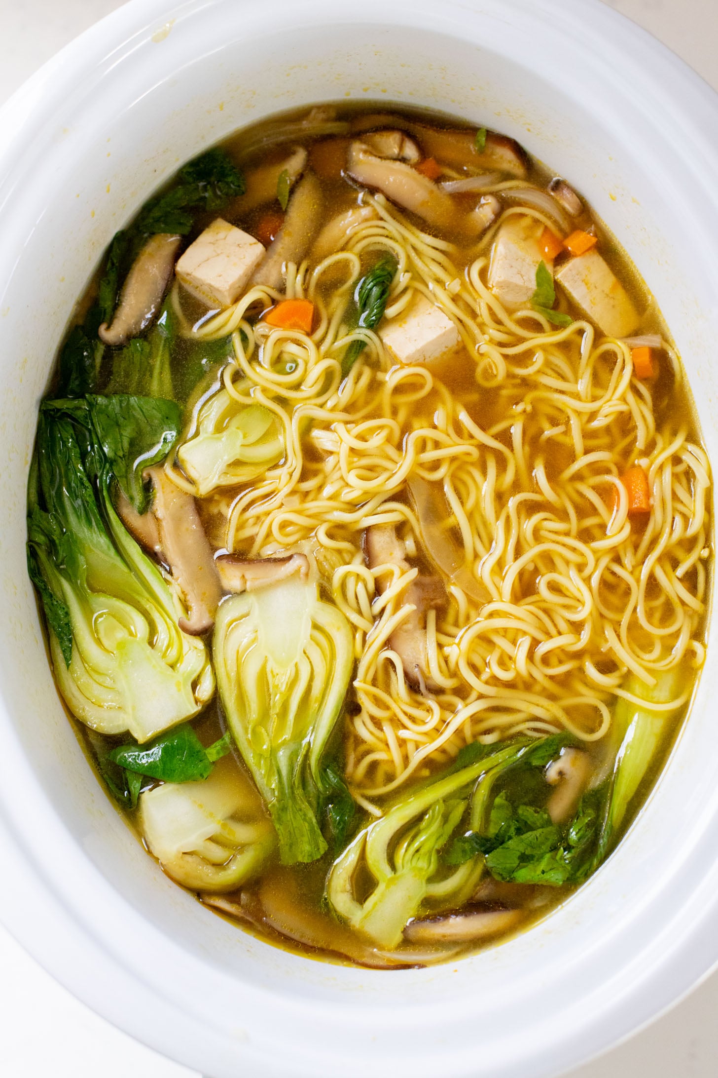 This Slow Cooker Vegan Ramen is a super easy way to make homemade ramen. Packed with veggies & tofu, this is a delicious dish | ThisSavoryVegan.com