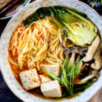 This Slow Cooker Vegan Ramen is a super easy way to make homemade ramen. Packed with veggies & tofu, this is a delicious dish | ThisSavoryVegan.com