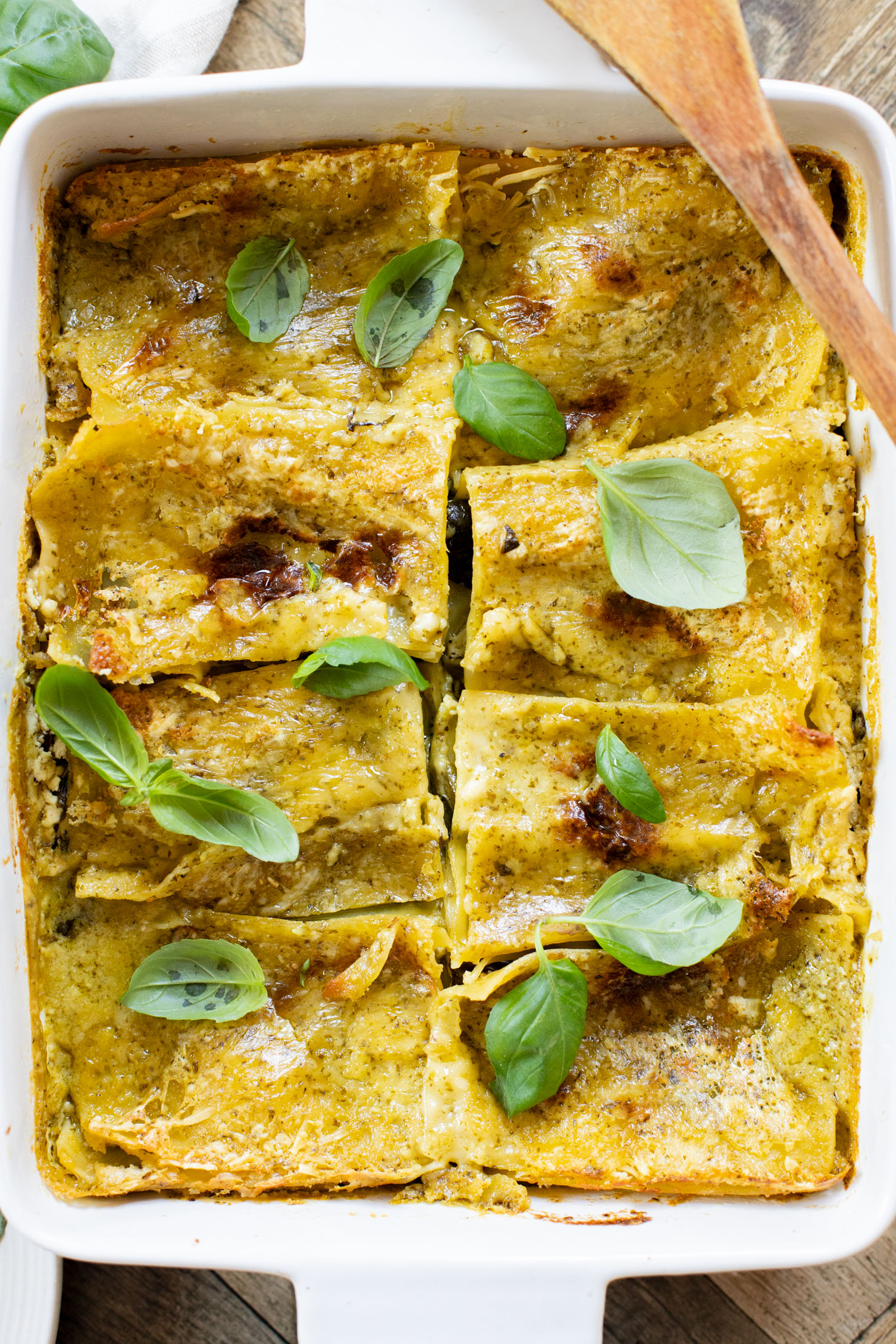 This Vegan Pesto Lasagna is layered with zucchini, spinach, lasagna noodles, tofu ricotta and a pesto béchamel sauce | ThisSavoryVegan.com