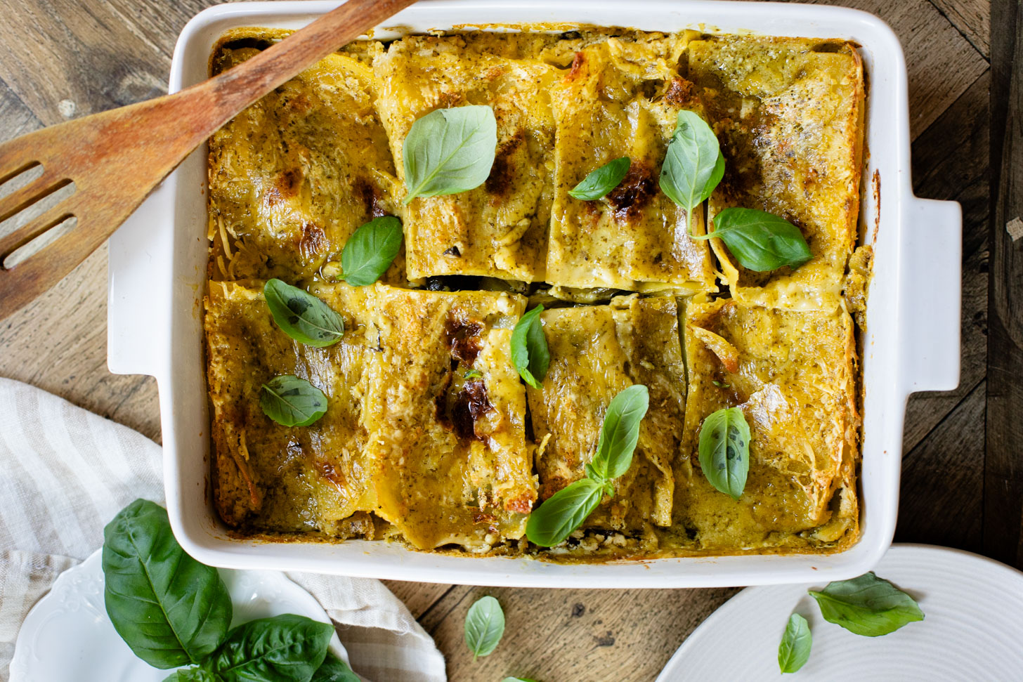 This Vegan Pesto Lasagna is layered with zucchini, spinach, lasagna noodles, tofu ricotta and a pesto béchamel sauce | ThisSavoryVegan.com