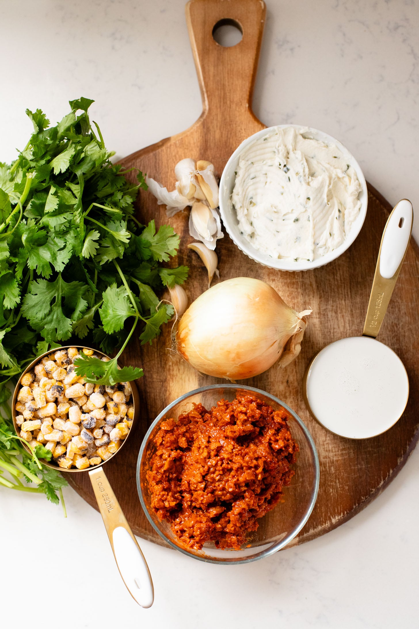 This Creamy White Beans & Soy Chorizo recipe is a cozy one-pot dinner. The beans are simmered in a creamy broth & topped with soy chorizo & corn | ThisSavoryVegan.com