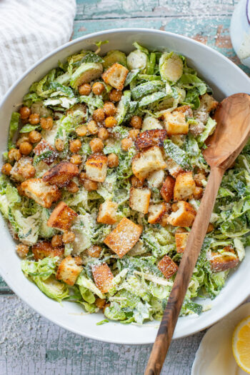 This Shaved Brussels Sprouts Caesar Salad is 100% dairy-free and totally tasty! A fall take on a classic salad recipe | ThisSavoryVegan.com