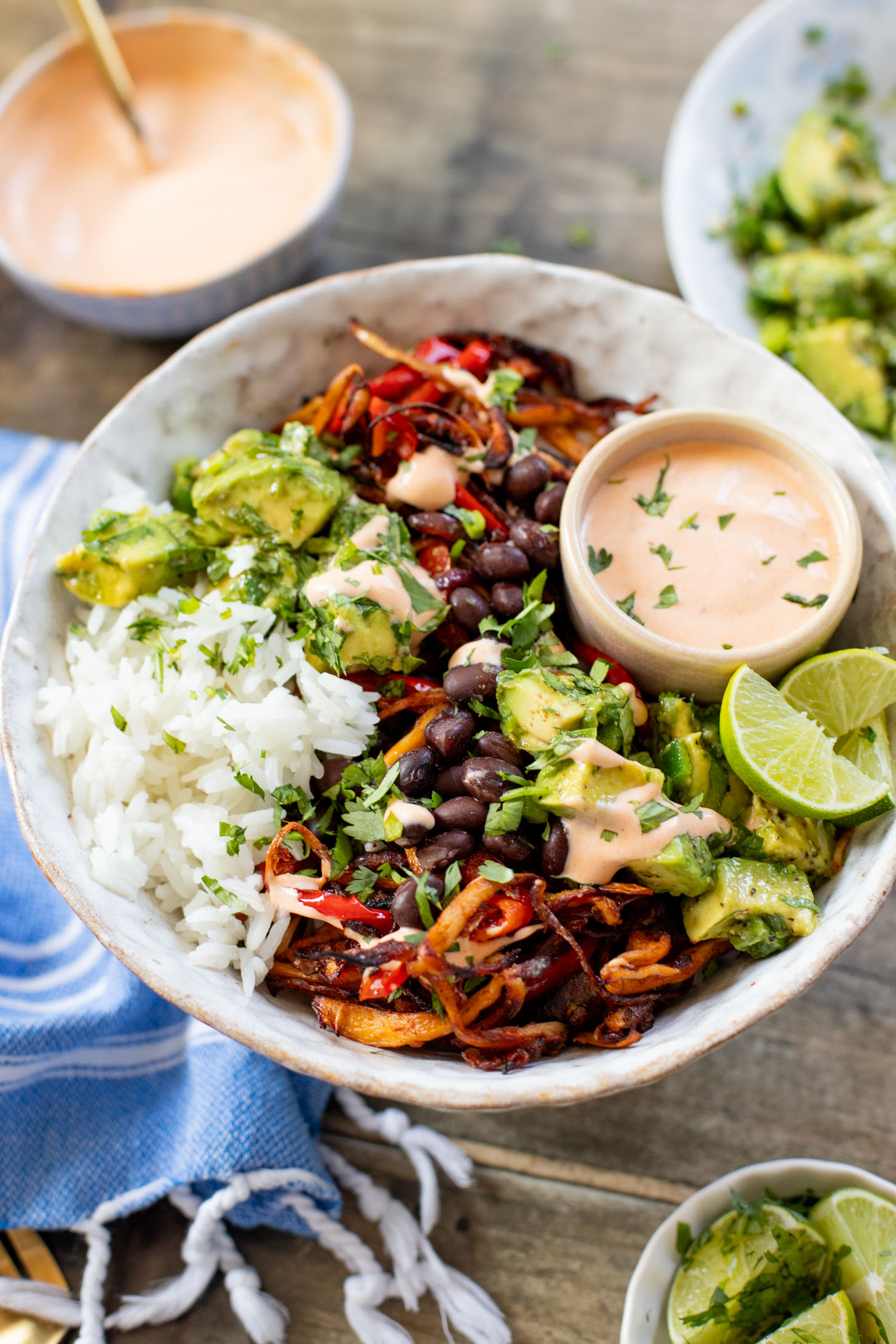 These Chipotle Oyster Mushroom Bowls are like fajitas with the addition of crispy mushrooms. Topped with avocado & dairy-free chipotle mayo | ThisSavoryVegan.com
