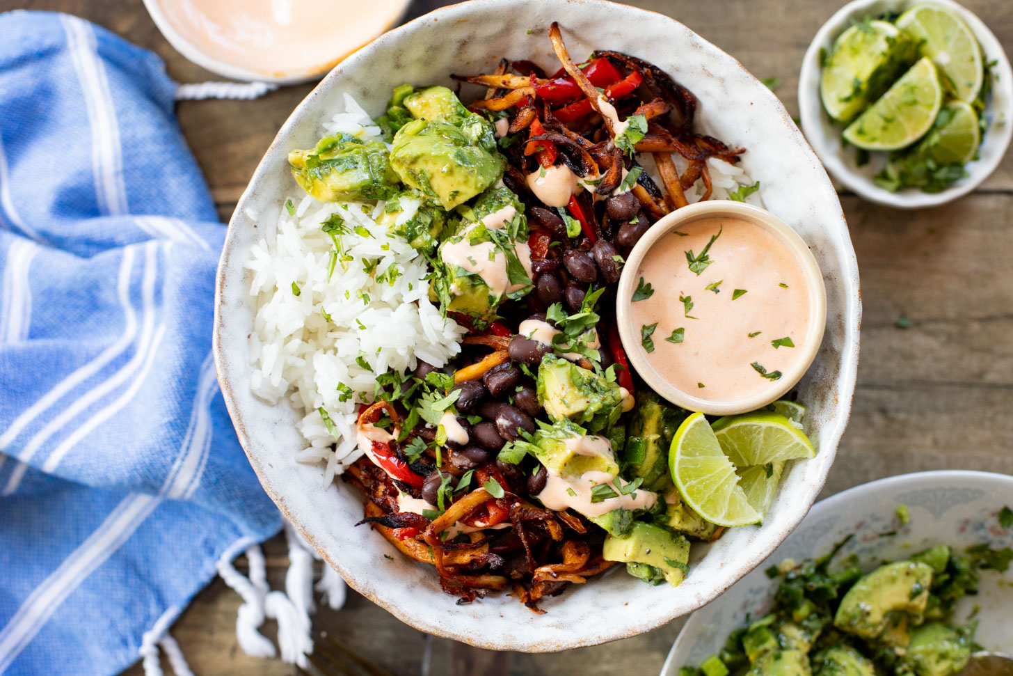 These Chipotle Oyster Mushroom Bowls are like fajitas with the addition of crispy mushrooms. Topped with avocado & dairy-free chipotle mayo | ThisSavoryVegan.com